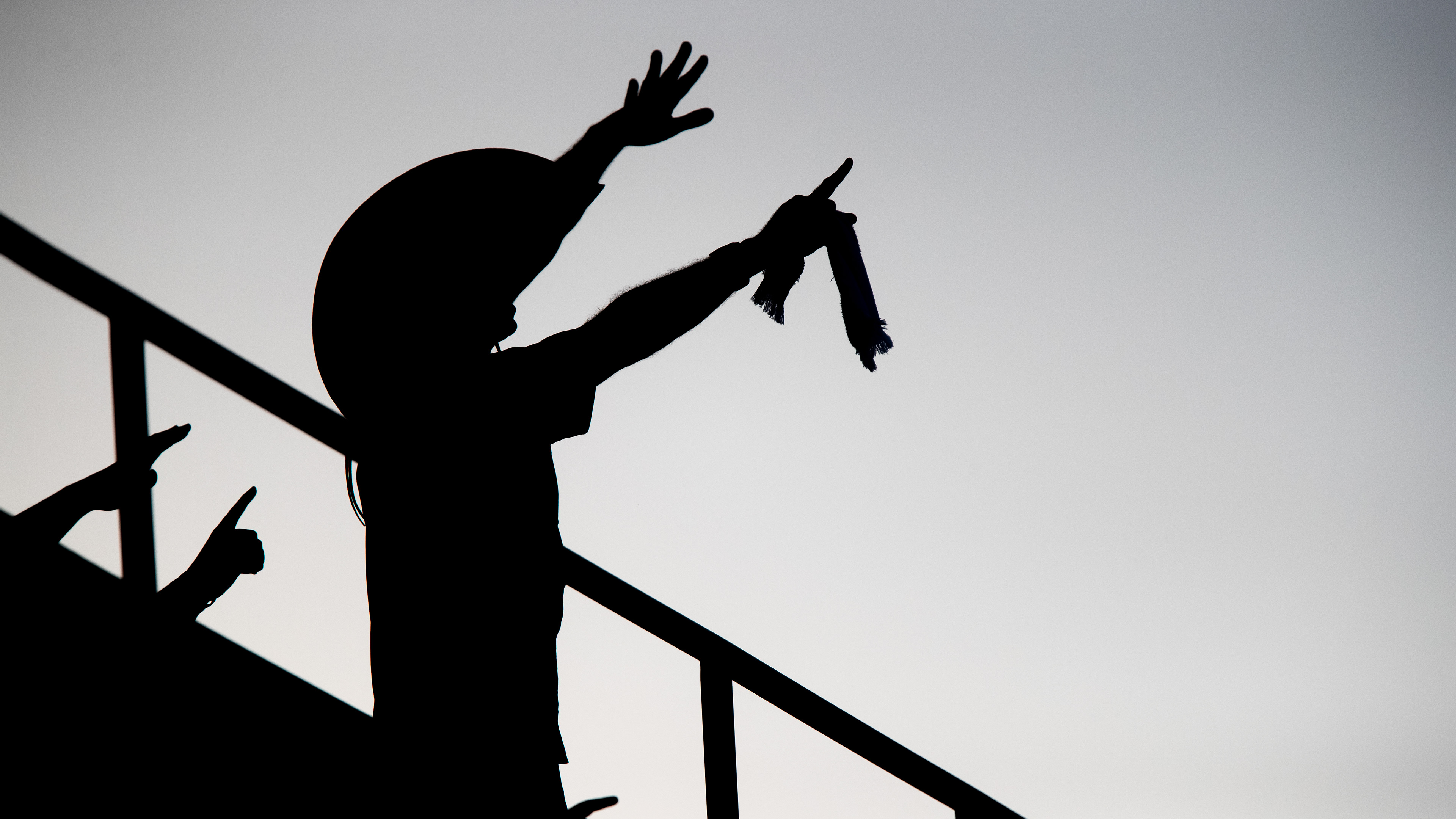 Matthew Herring '95 leads a "Ball 6" chant at sunset during Game 5 of the College Station Super Regional at Olsen Field on Friday, June 10, 2022.