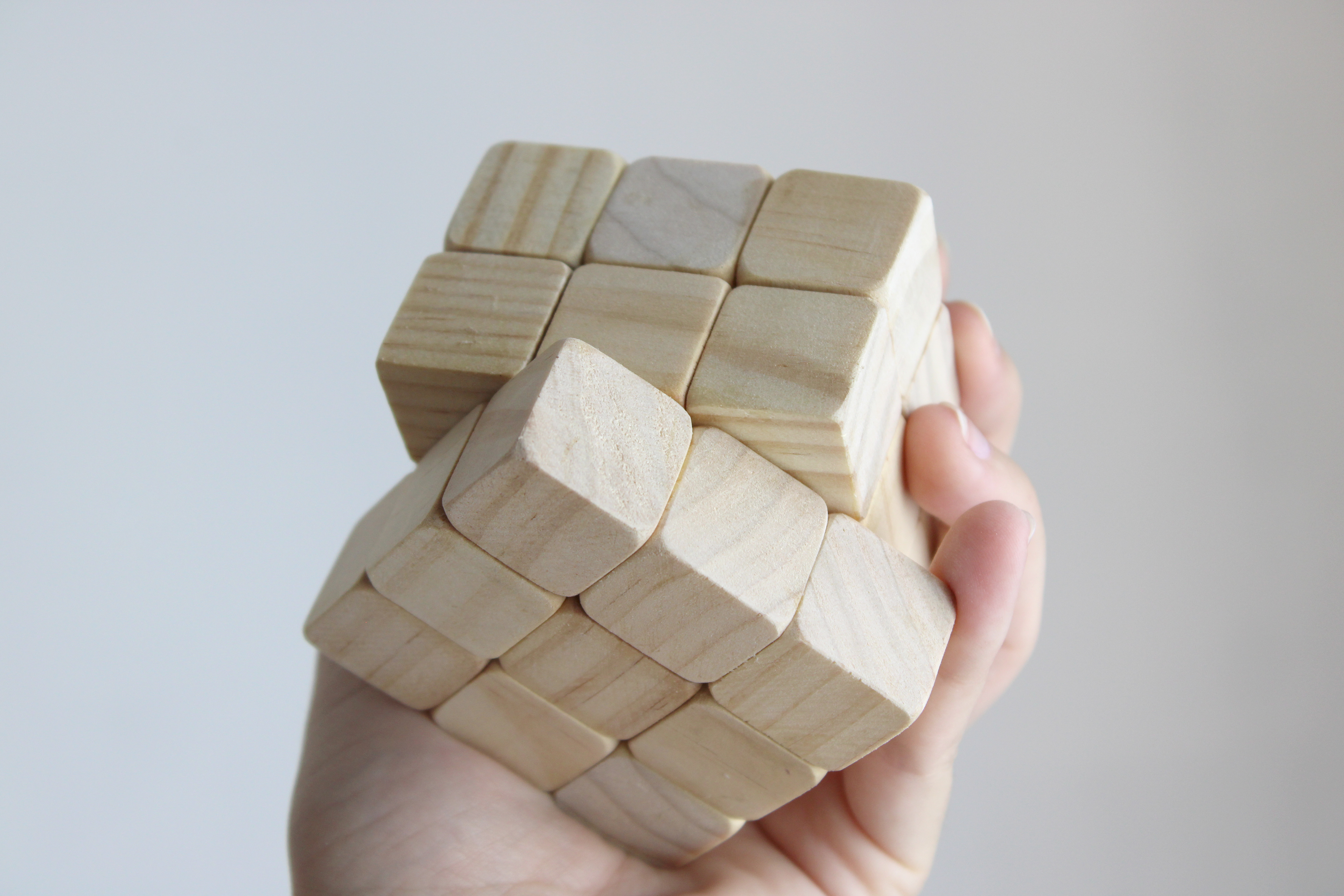 How to solve a Rubik's Cube, 2024, scultura in legno, 6 x 6 x 6 cm.