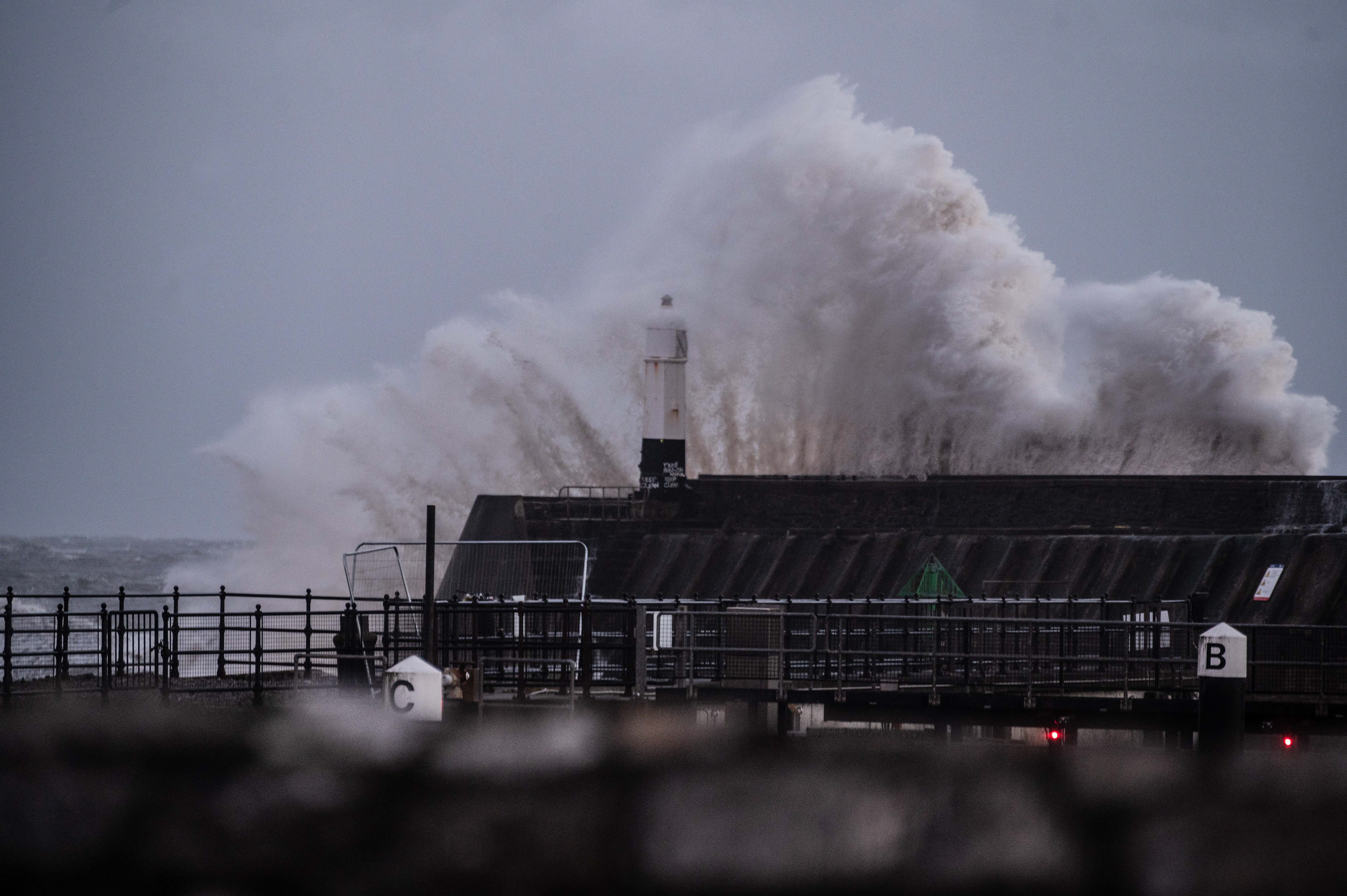Penarth, UK. Storm Eunice alert hits the lighthouse in Penarth as the red weather warning was issued for Wales. Photo © Karolina Król 18/02/2022