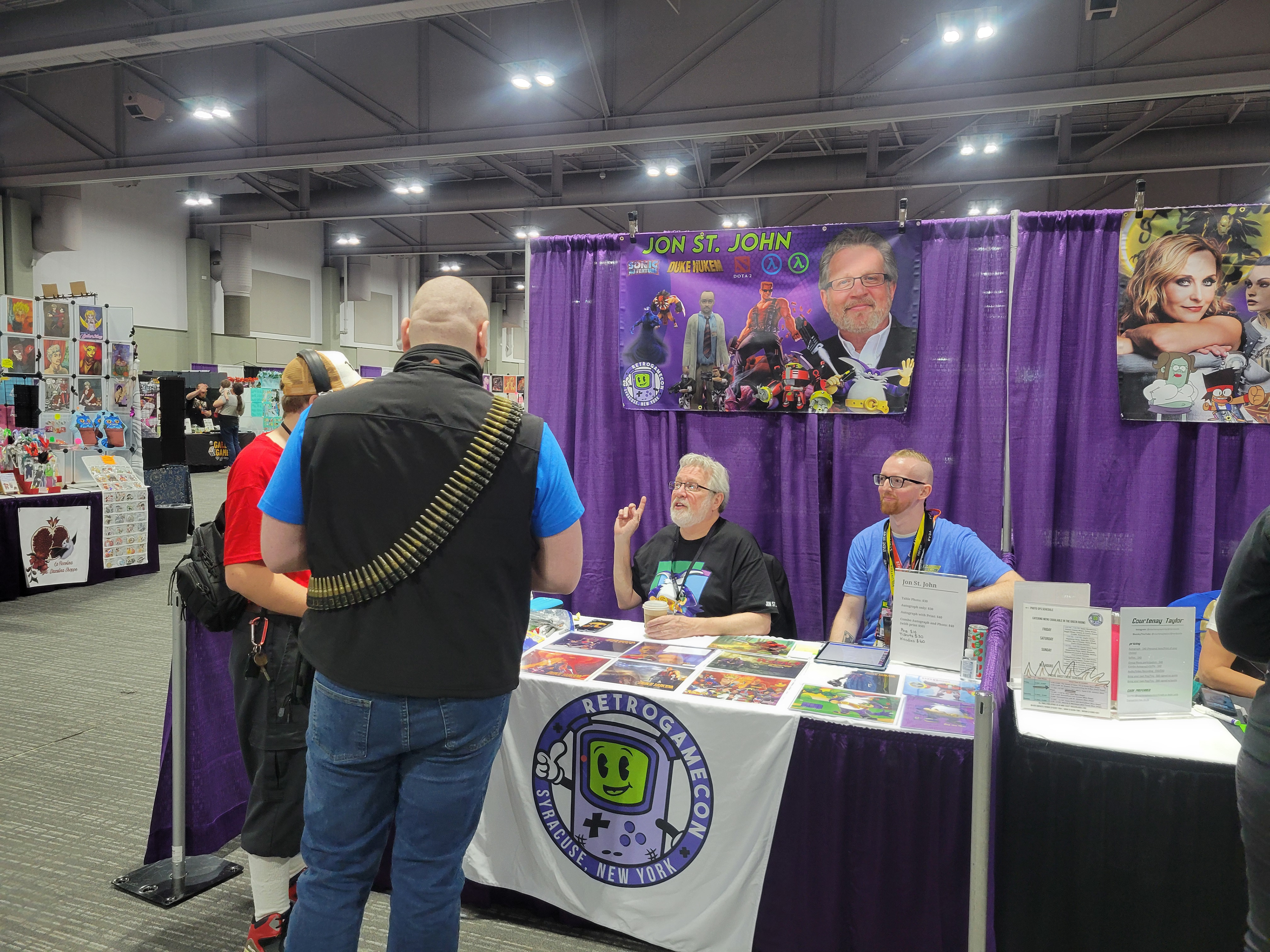 Voice actor Jon St. John Speaking to a fan at a convention both