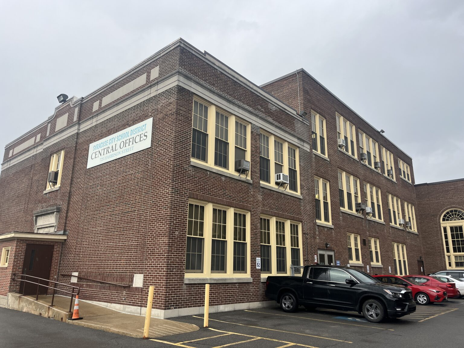 Brown office building on a cloudy day