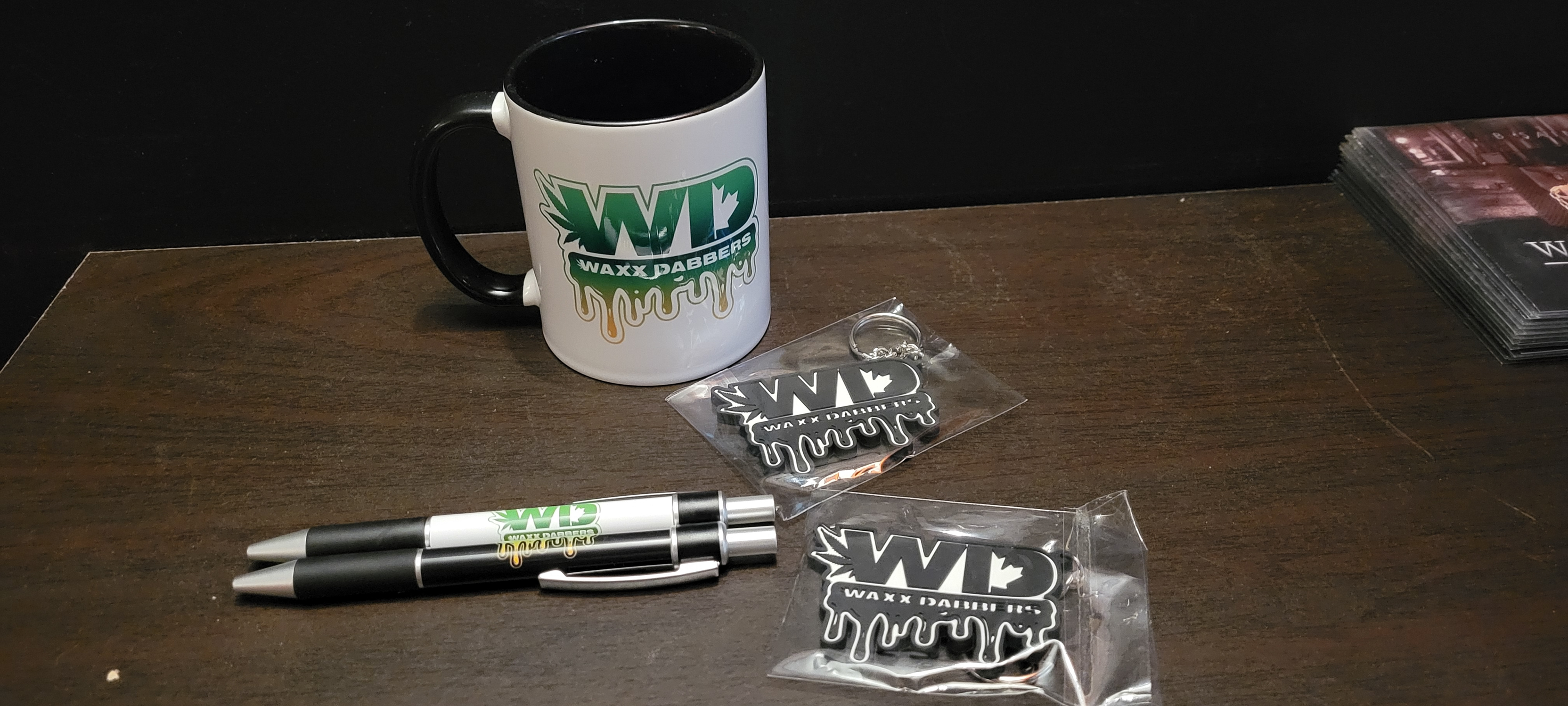 Cups, pens and keychains.