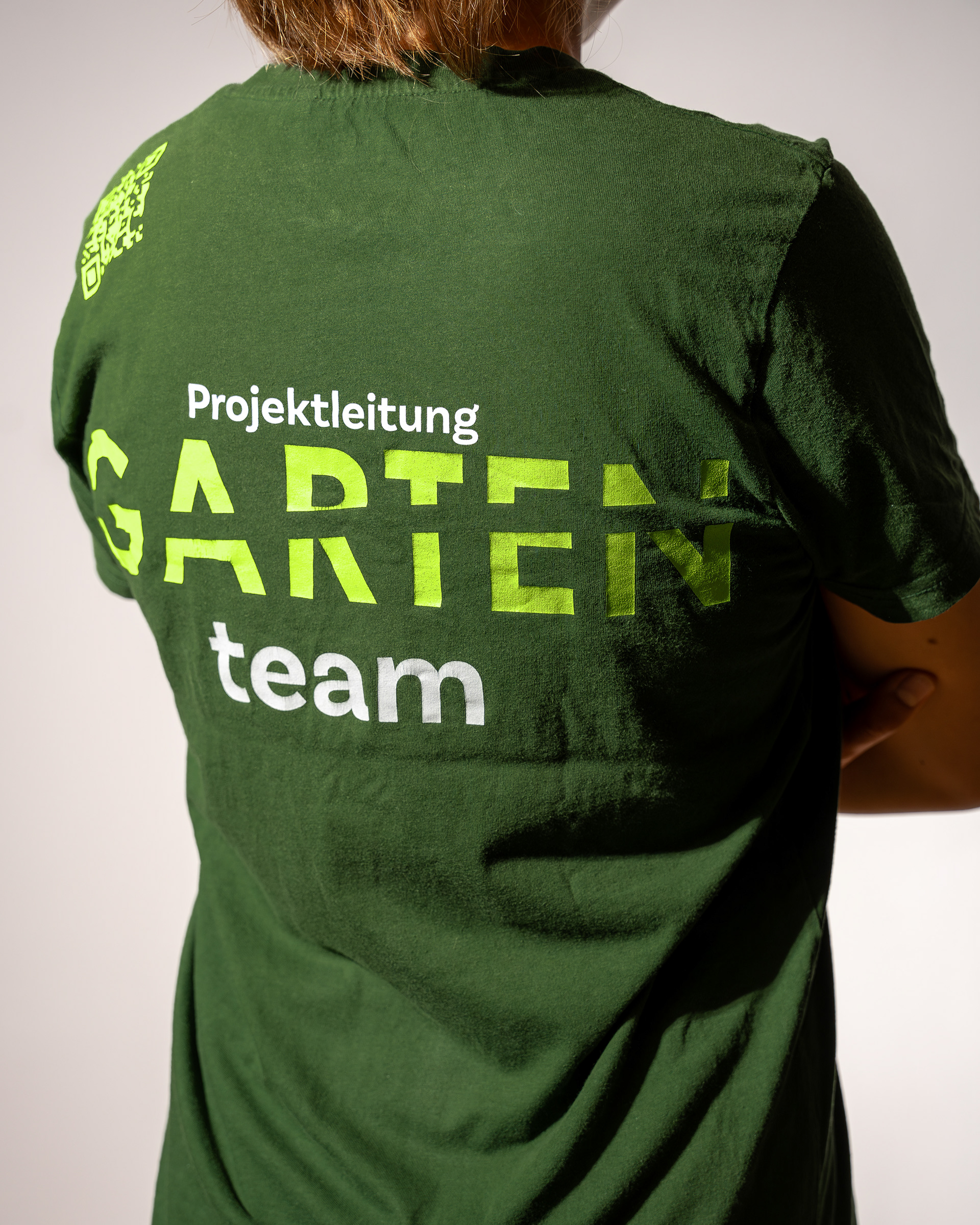 Detailansicht: Backprint Garten-Team mit Rollentitel als extra