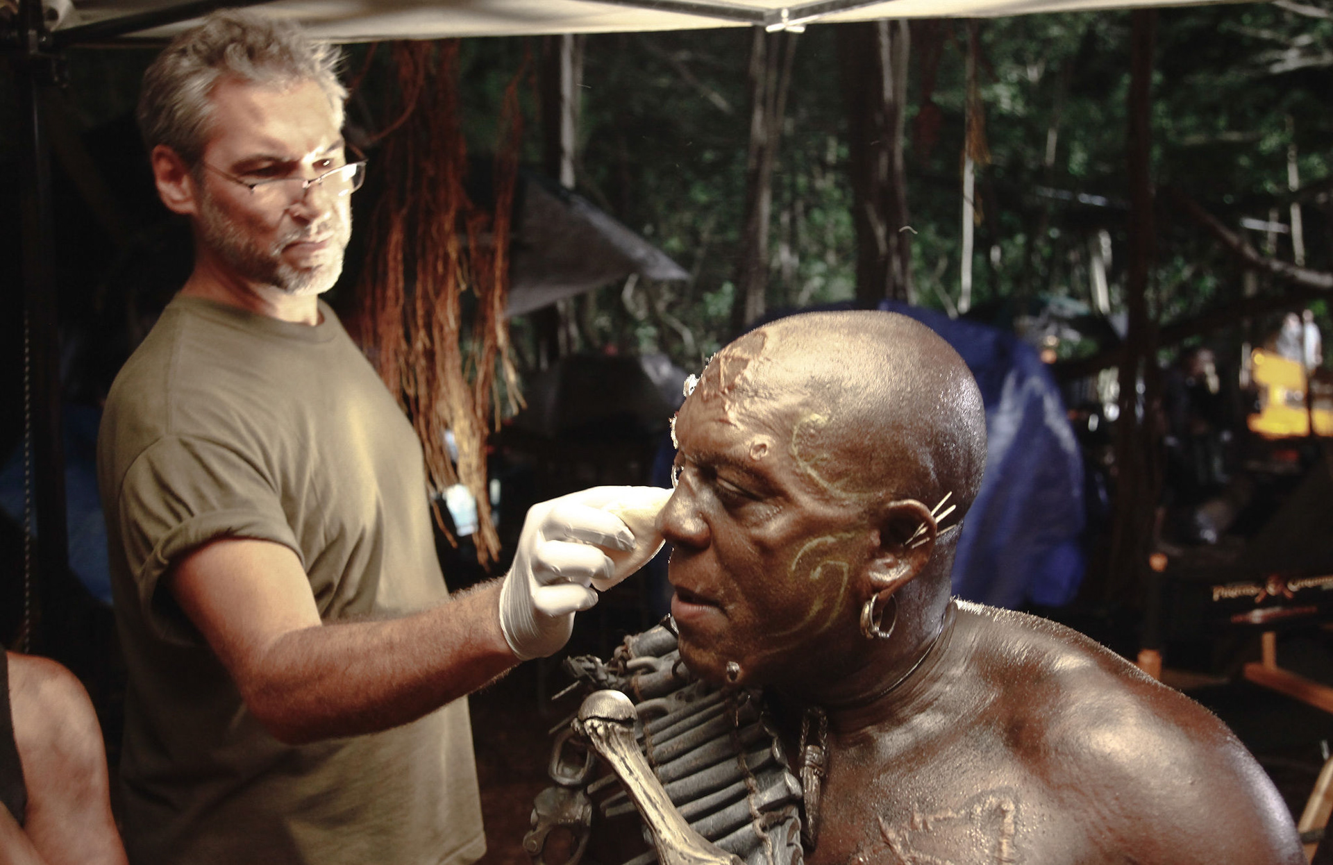 Mike Smithson applying makeup on Deobia Oparei