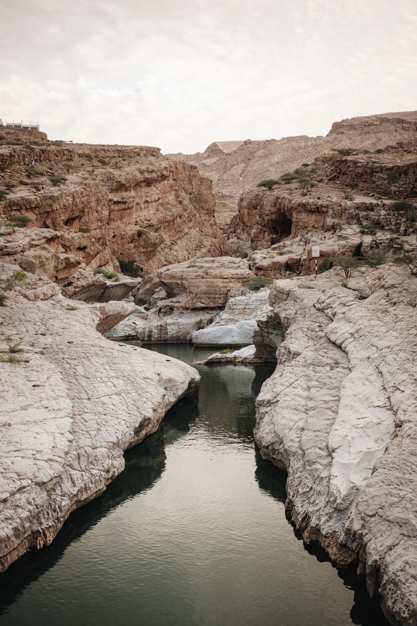Wadi Bani Khalid is the perfect stop when driving from Nizwa to the desert landscape of Wahiba Sands. Almost 300 km separate both destinations, thus a swim in the crystal clear waters of Wadi Bani Khalid is more than welcome. The pools of Wadi Bani Khalid are probably some of the most beautiful ones in Oman. The location is well signposted and there are several picnic sites closeby. The scenery is incredibly beautiful and a perfect place for swimming. Put your feet into the first pool and get a pedicure by the little fish. I highly recommend getting away from the first pool which is often crowded. Hike towards the Moqal cave (signposted) and have a swim in the smaller, more scenic pools. Important: The Wadi Bani Khalid Pools are public, thus you need to wear appropriate swimwear. Bring a torchlight if you want to explore the Moqal cave. Entrance: free
