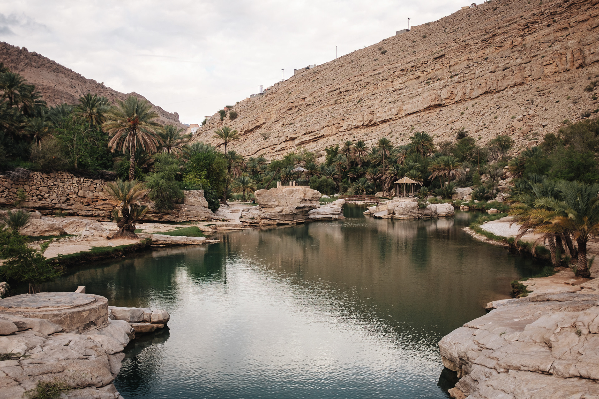Wadi Bani Khalid is the perfect stop when driving from Nizwa to the desert landscape of Wahiba Sands. Almost 300 km separate both destinations, thus a swim in the crystal clear waters of Wadi Bani Khalid is more than welcome. The pools of Wadi Bani Khalid are probably some of the most beautiful ones in Oman. The location is well signposted and there are several picnic sites closeby. The scenery is incredibly beautiful and a perfect place for swimming. Put your feet into the first pool and get a pedicure by the little fish. I highly recommend getting away from the first pool which is often crowded. Hike towards the Moqal cave (signposted) and have a swim in the smaller, more scenic pools. Important: The Wadi Bani Khalid Pools are public, thus you need to wear appropriate swimwear. Bring a torchlight if you want to explore the Moqal cave. Entrance: free