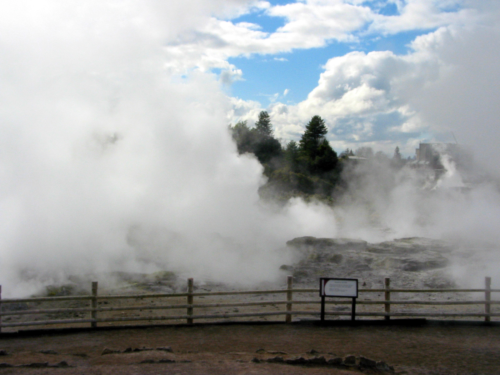 Steam partially covers the blue sky