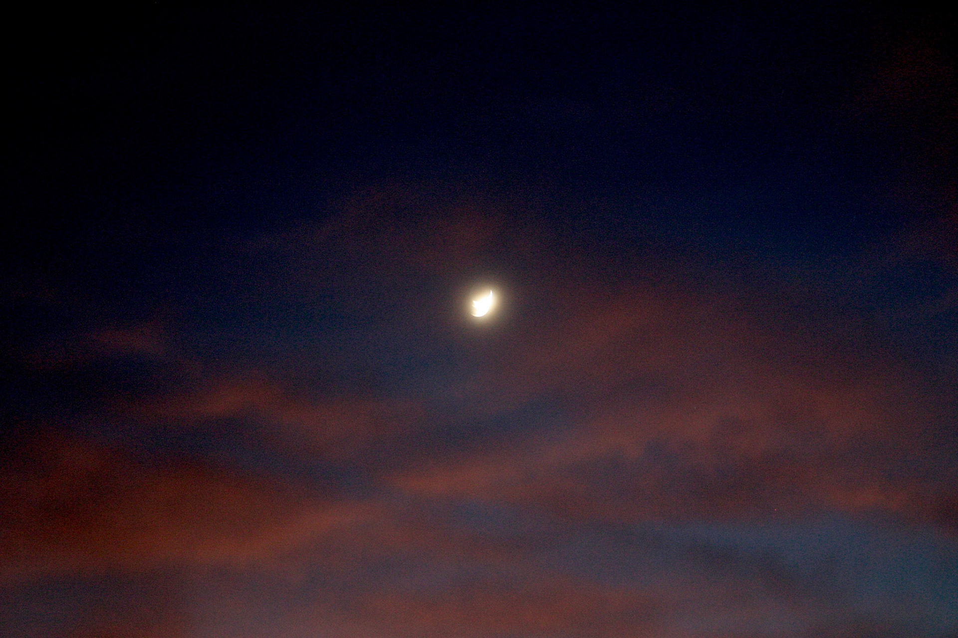 A mystical moon at twilight