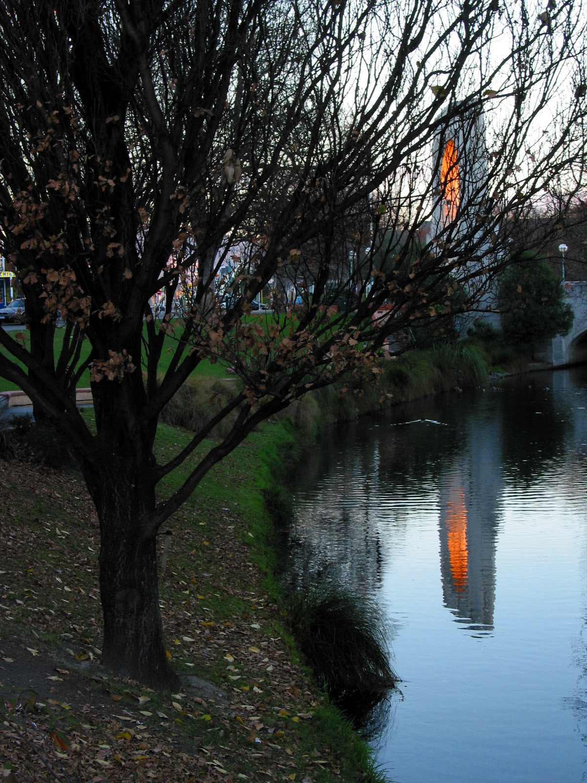 Sun on bridge arch reflecting in Avon River