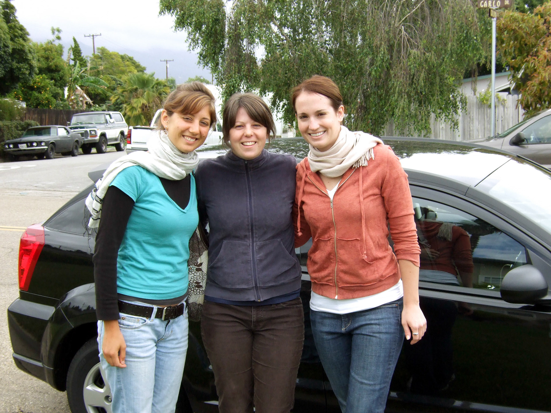 Rachel, Abbie and me next to our little car at Mom and Dad's house before heading up the coast