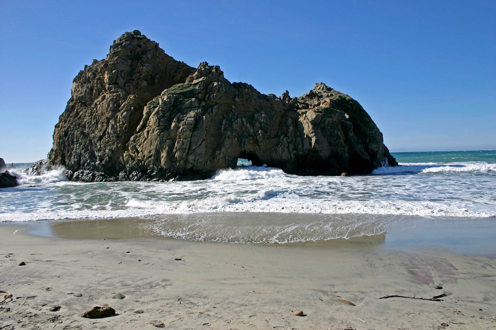 A large rock formation on a Big Sur beach
