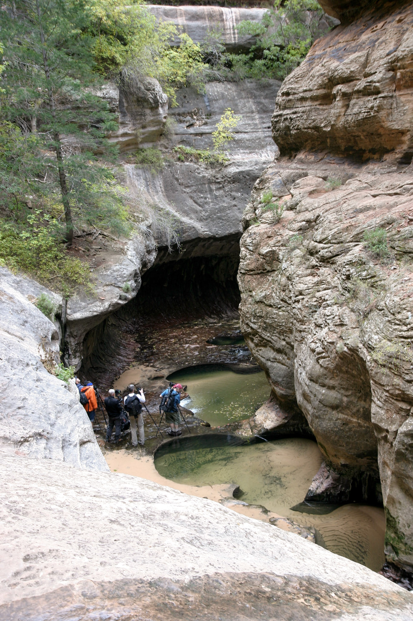 Looking down at the popular spot to do extended exposure photographs, hence the multiple photographers lined up with their tripods