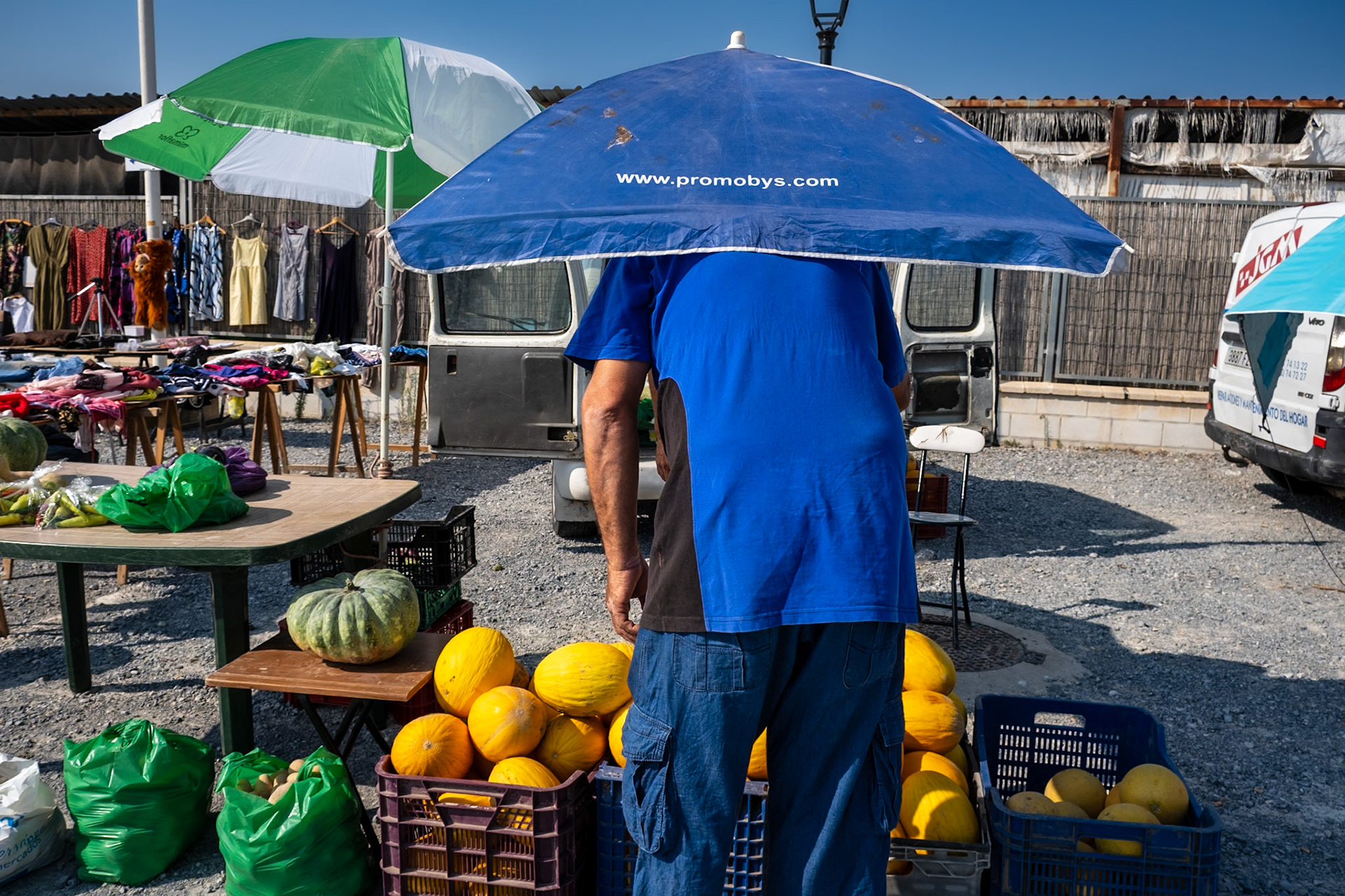 Sheilding from the sun in a blazing hot market in Almeria, southern Spain.