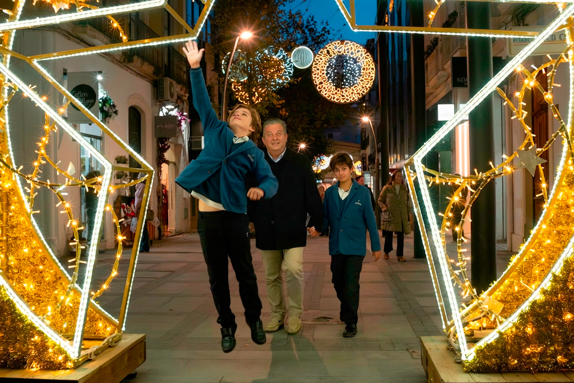 A father and his sons in Almeria City at Christmas time.