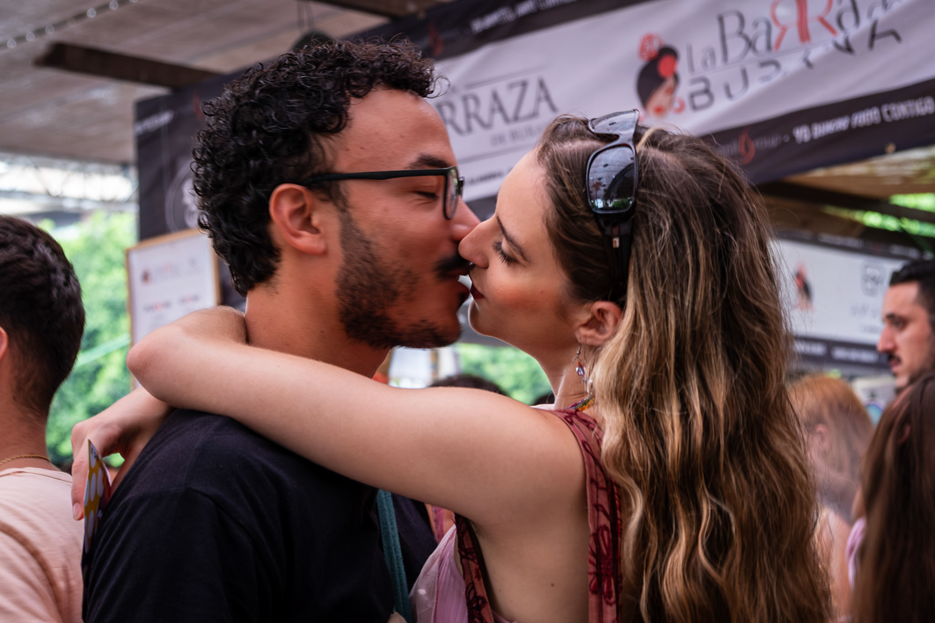 Two lovers kiss at the Feria de Mediodia, Almeria City, soutyhern Spain.