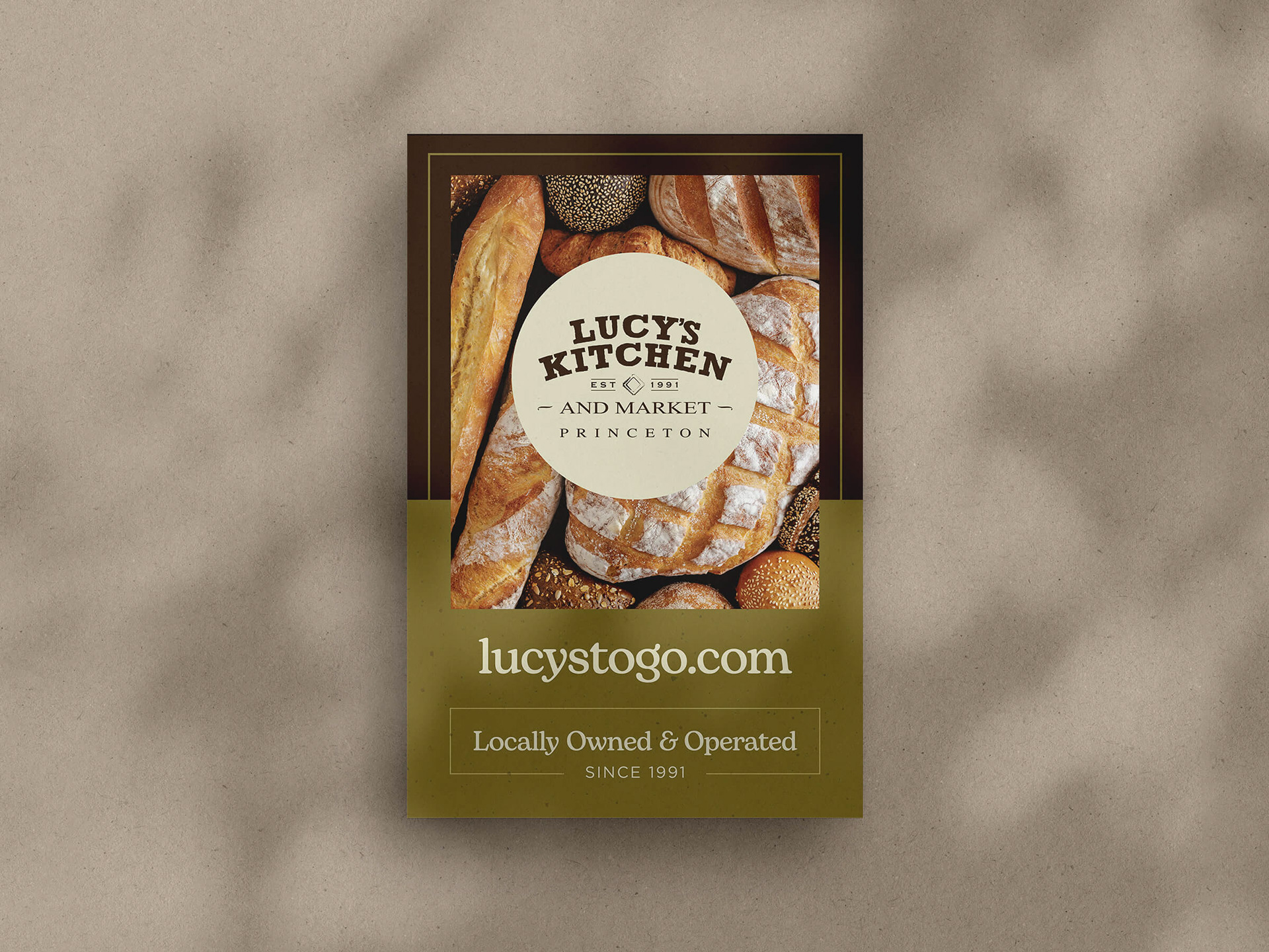 Artisan poster on a wall with a photo of different kinds of bread and text 