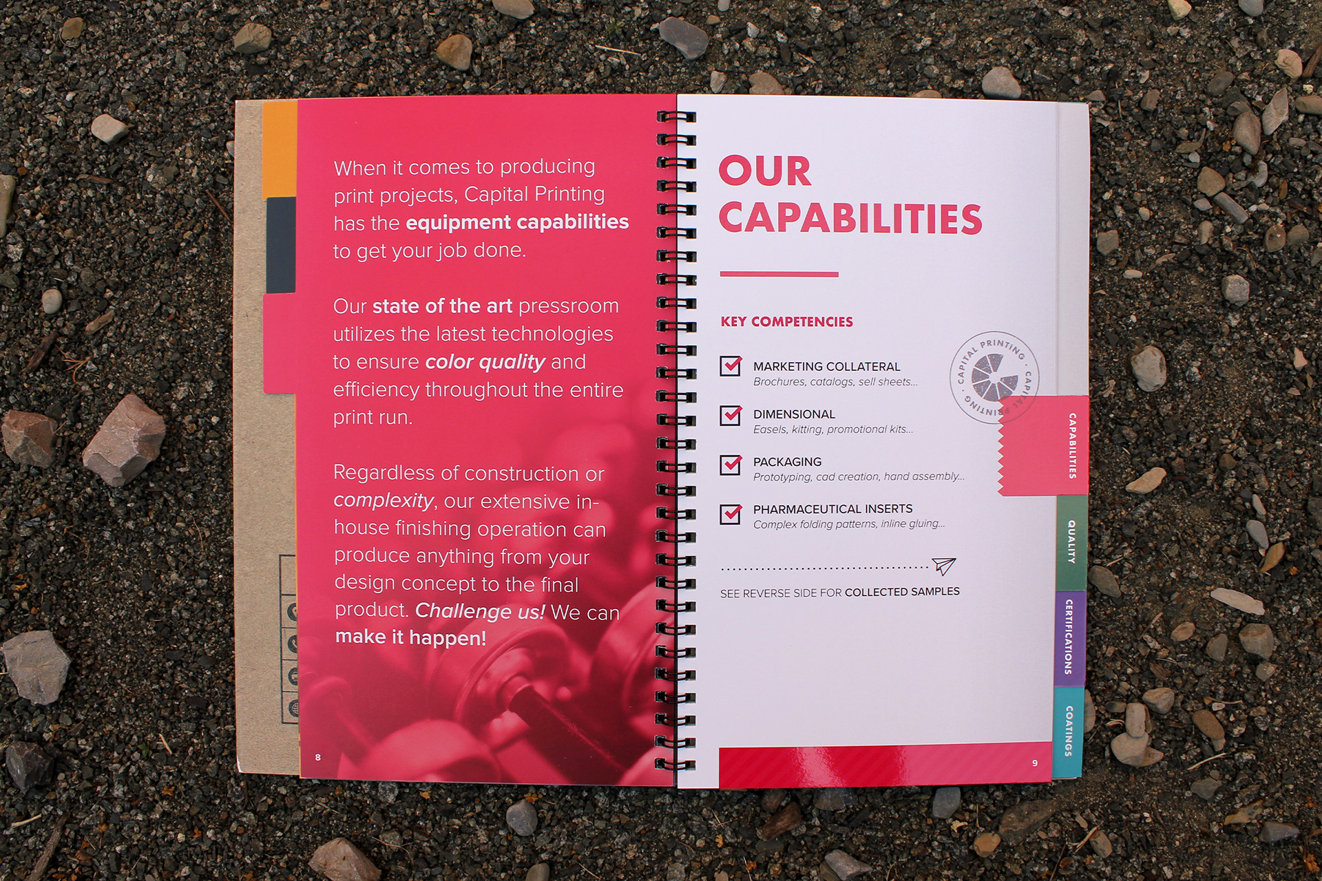 An open spiral notebook on the ground