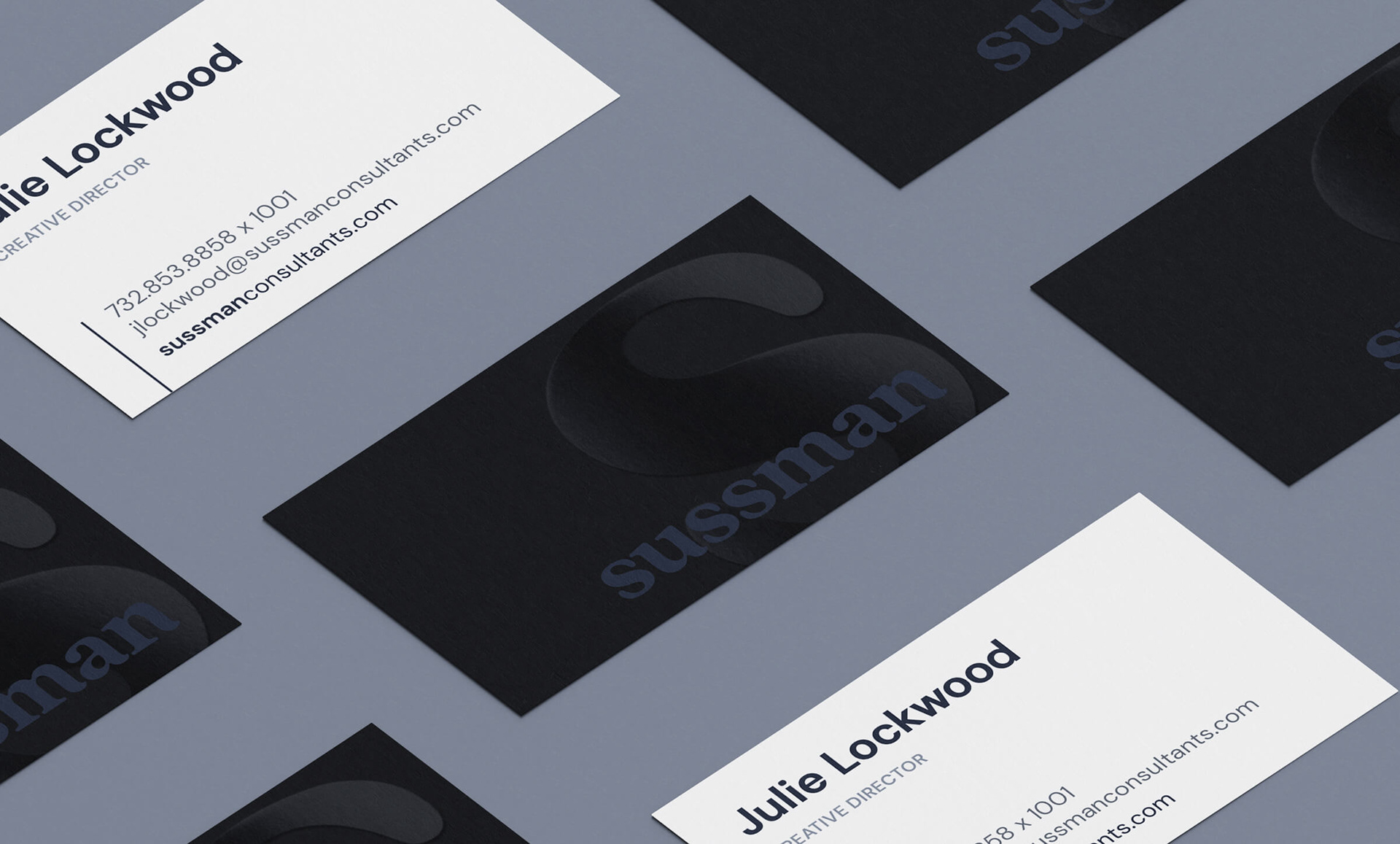 A mockup of multiple business cards laid on a flat surface