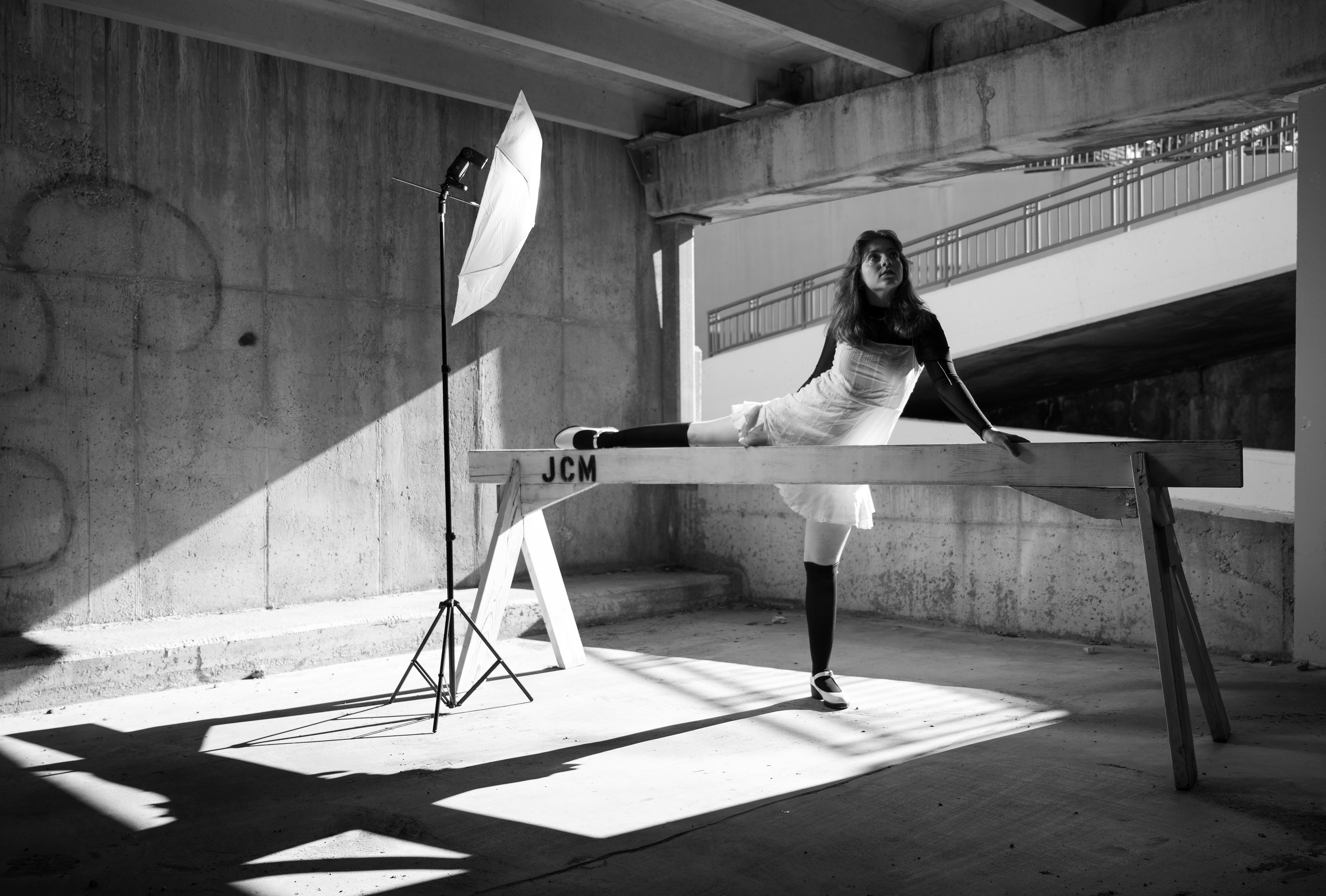 Portrait of Riley, a dancer, in a parking garage near my home in Overland Park, Kansas. Lit with speedlight flash.