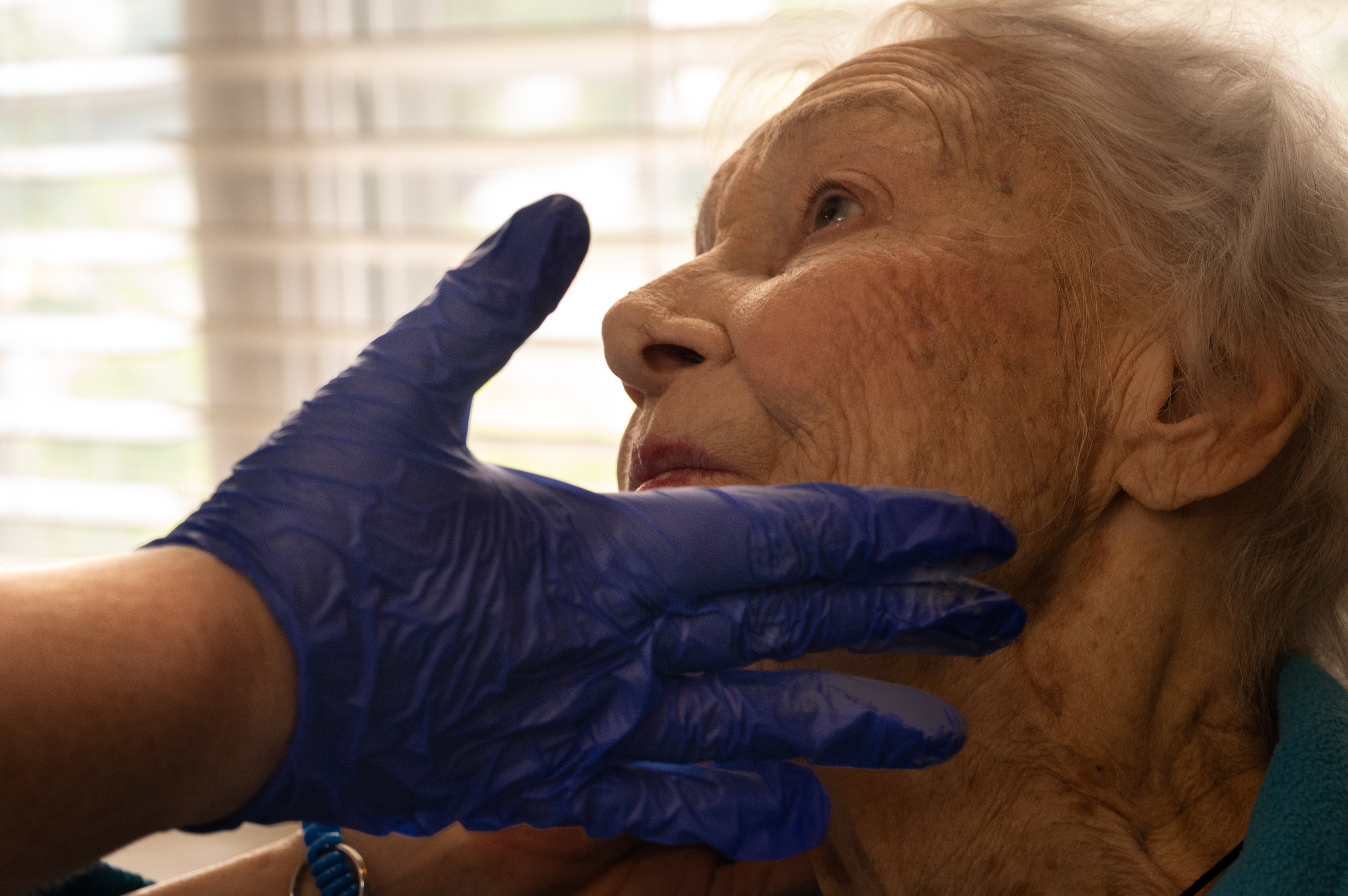 Amanda McNish applies blush to compliment Patricia's lipstick at Pegasus Senior Living.