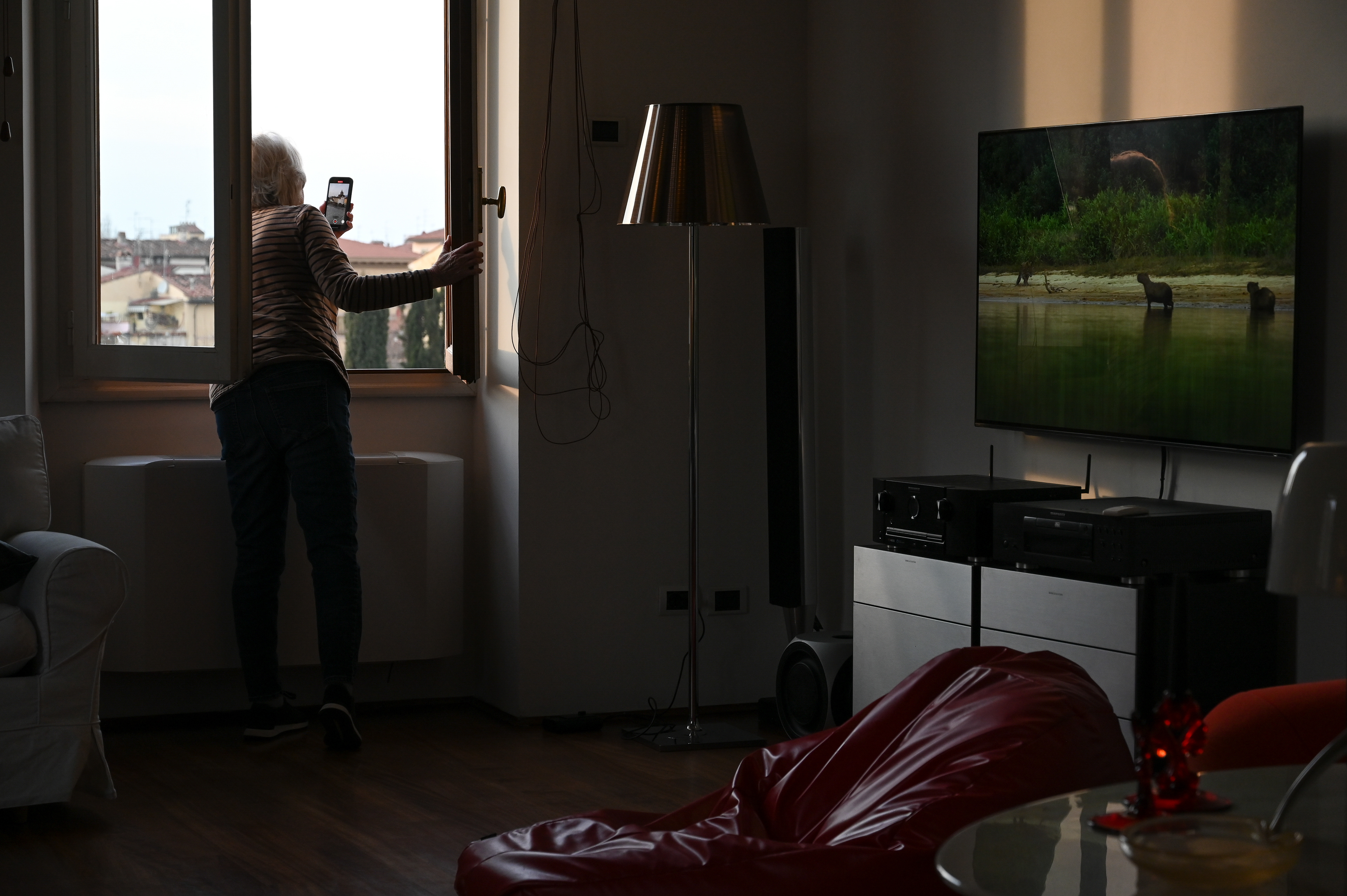 Anita takes a photo from the window of our rental apartment in Florence, Italy. 