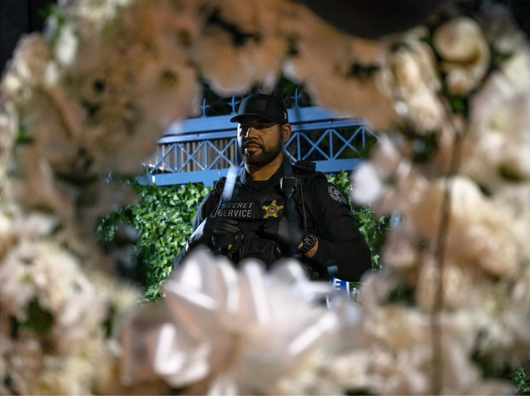 A Secret Service officer stands outside of the Israeli Embassy during a vigil for Aaron Bushnell on February 25, 2024, the first anniversary of his self-immolation outside of the embassy.