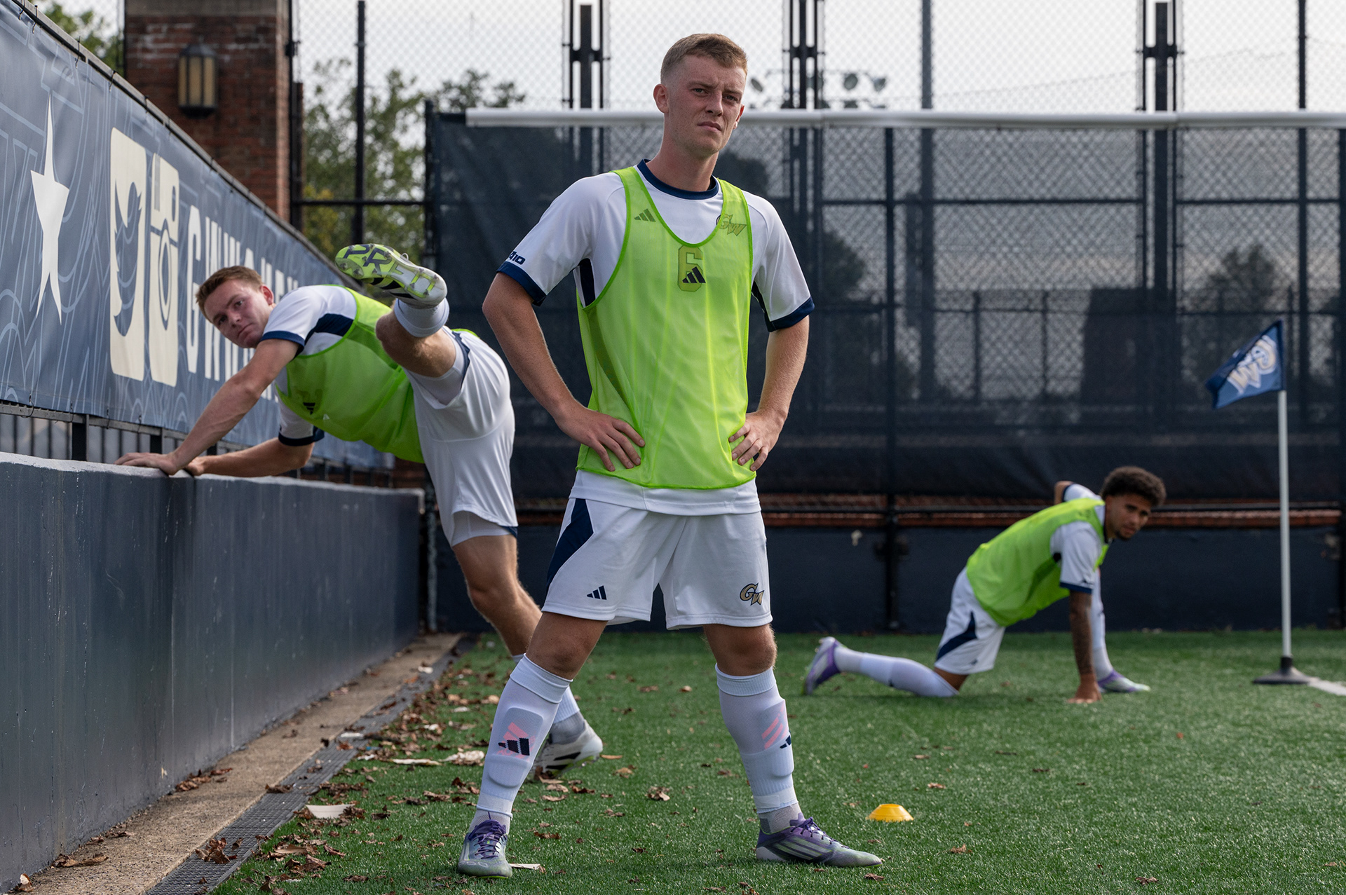 Liam Coffey (center) and two teammates warm up as they prepare to be substituted into the game on Saturday, September 20, 2025. 