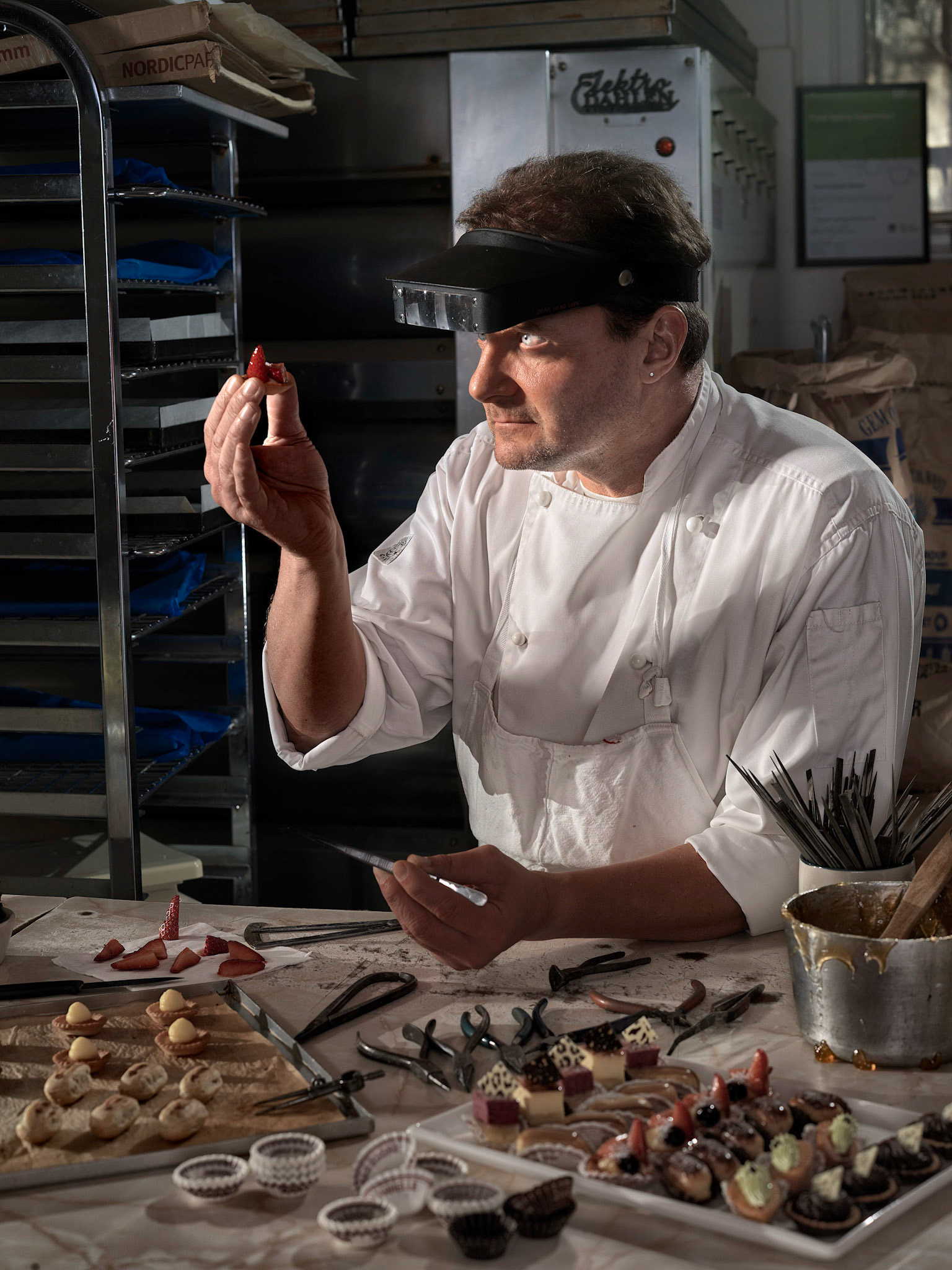 Jean Francois Perron takes great care when decorating his petit fours which are his specialty. His petit fours are true miniature creations, I wanted to communicate this by the use of jewelers tools to suggest the kind exacting care he takes in making them. Originally from France he moved to Sydney 18 years ago and now has his own shop where this photo was taken, tucked away in the back streets of Ryde delighting locals with his creations