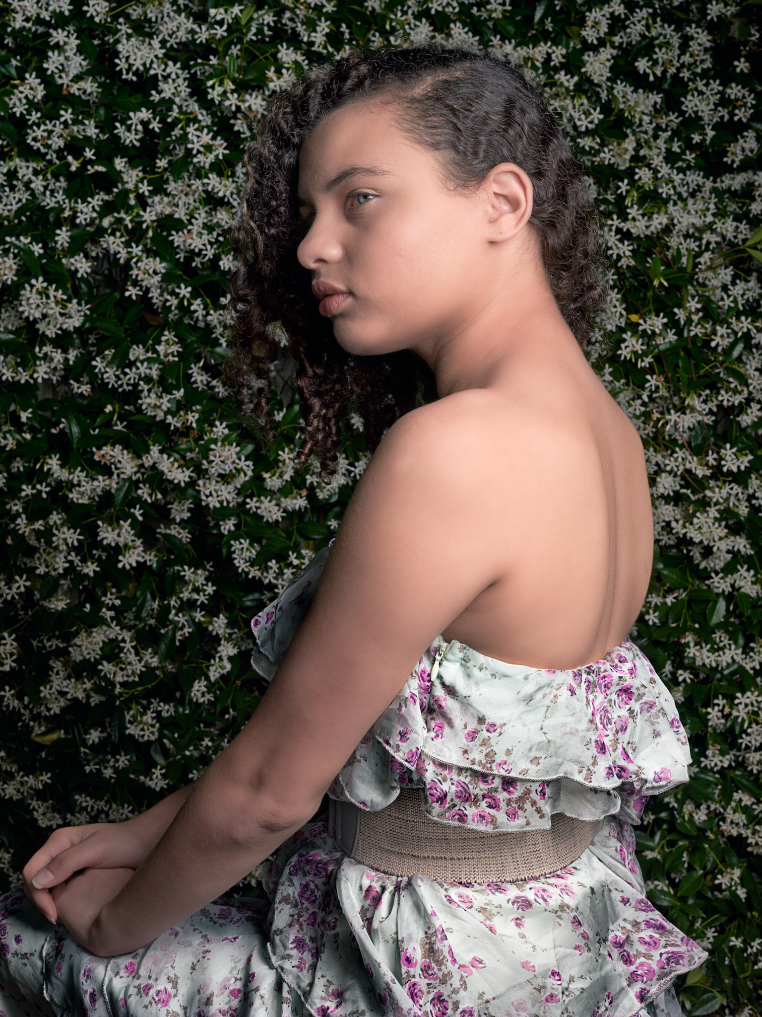 I had been keeping an the jasmine bush in our backyard for a while. During the first week of spring I looked out the window and saw that the bush was in full bloom, I had shot in mind for while and knew just who I wanted as a model, my seventeen year old niece. Her dress, the jasmine and her age all speak of spring.