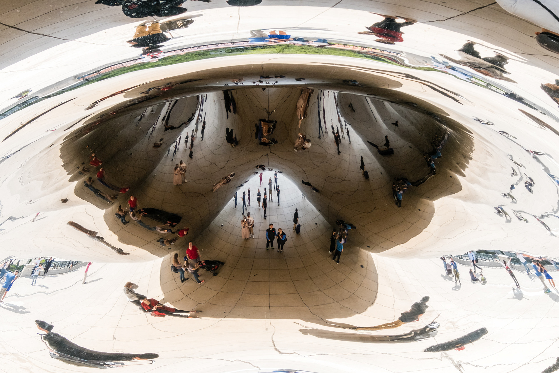 Bending Reality - Illusions created by the shiny curved surface of the "Cloud Gate" at Millenium Park, Chicago, Illinois, USA.