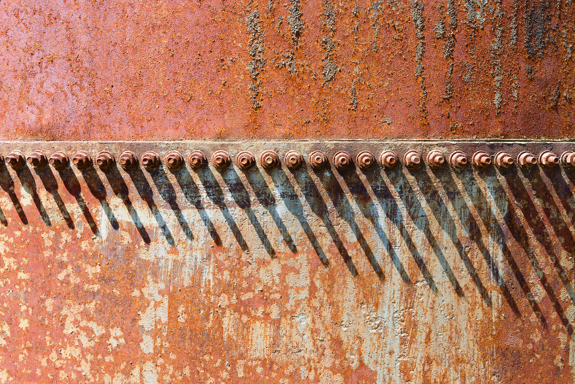 Increasing Shadows - Shadows cast by a line on nuts over a rusty tank. Cuñapirú dam, Rivera, Uruguay.