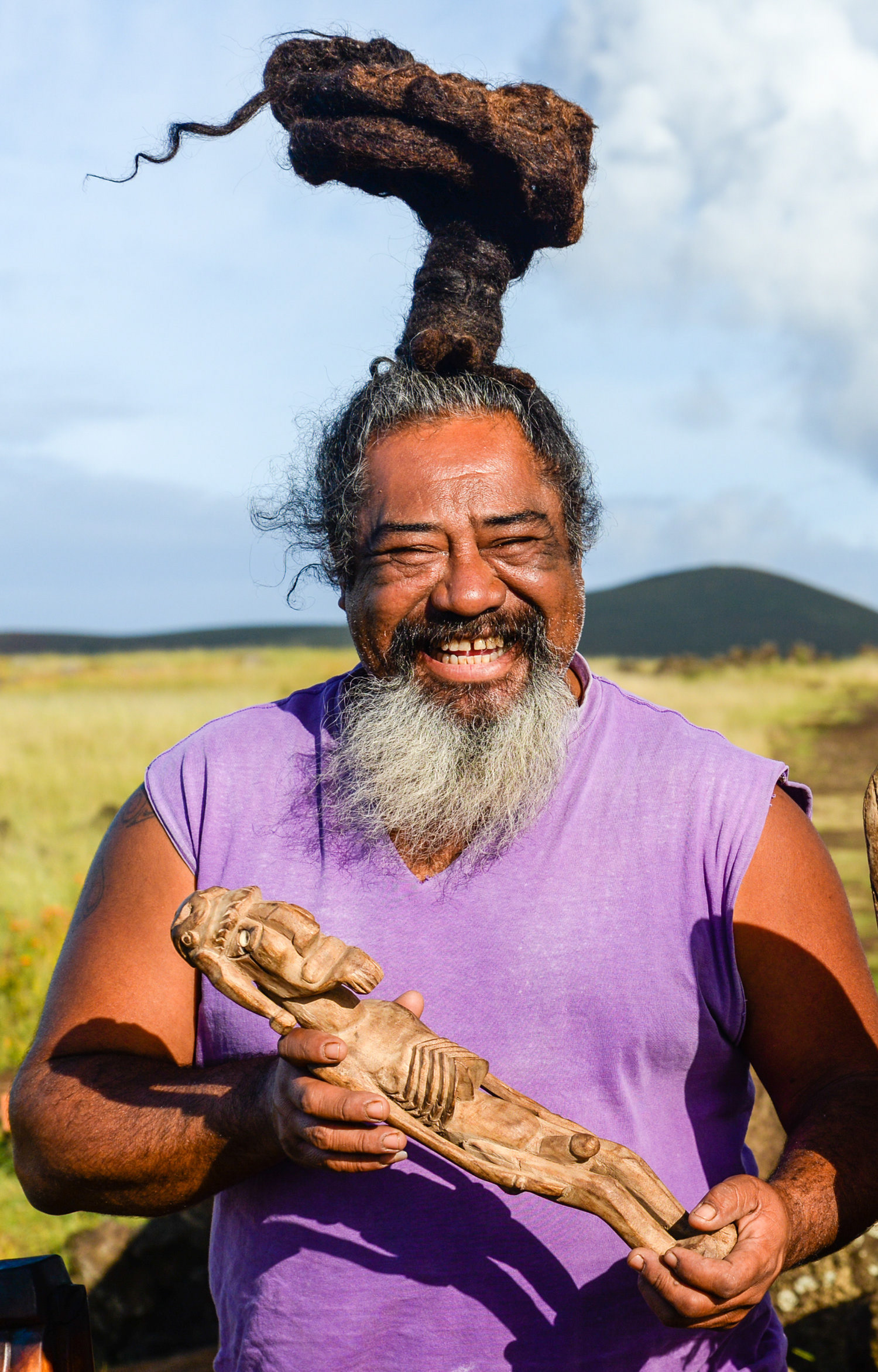 The Craftsman - Koro Pakarati. So is the name of this man who is dedicated to making wood crafts. He have a place to sell his things close to Ahu Akahanga on the southeast coast of the island. He was there since dawn. With a sleepy face, but he had all the energy and being gentile with his customers, all necessary to become a good trader and therefore, good seller. I saw him, heard him and put me in a very good mood. Without saying anything , just with his attitude, convinced me to buy some of his stuff. But of course... I had to ask him to take a picture of him. Awesome guy! Easter Island (Rapa Nui), Easter Island, Valparaiso Region, Chile.