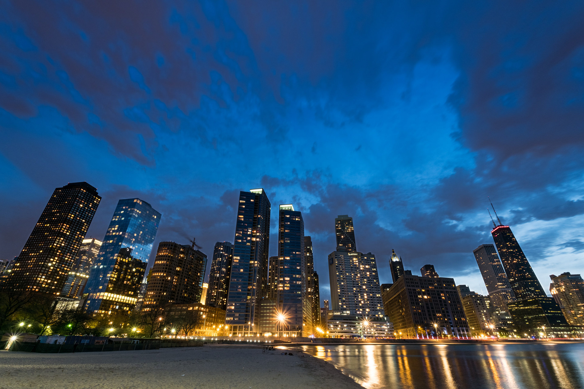 THE DUSK - Chicago cityscape seen from Ohio Street Beach during a very cold sunset. Chicago, Illinois, USA