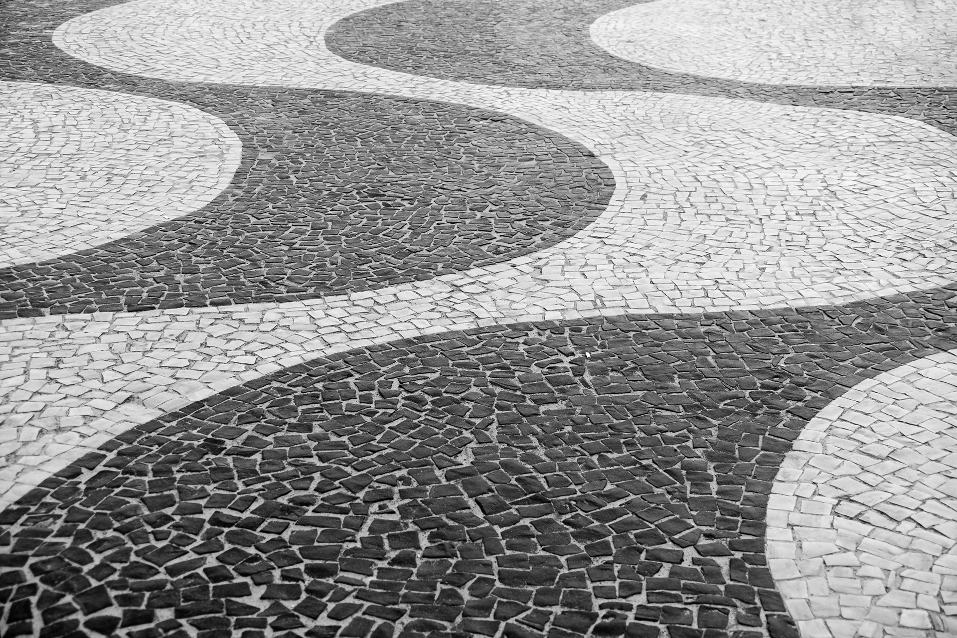 SS - Classic pattern of Copacabana sidewalk. Rio de Janeiro, Brazil.