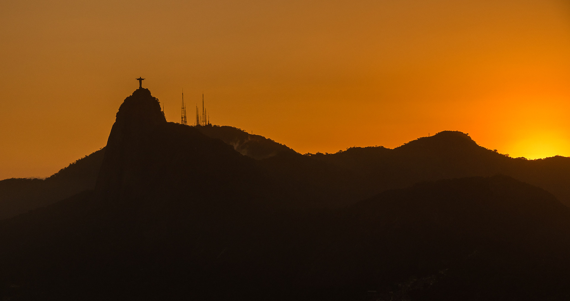 SPOTLIGHT - Typical landscape of Rio de Janeiro and its main attraction, the Christ Redeemer, seen from Sugar Loaf. Rio de Janeiro, Brazil.