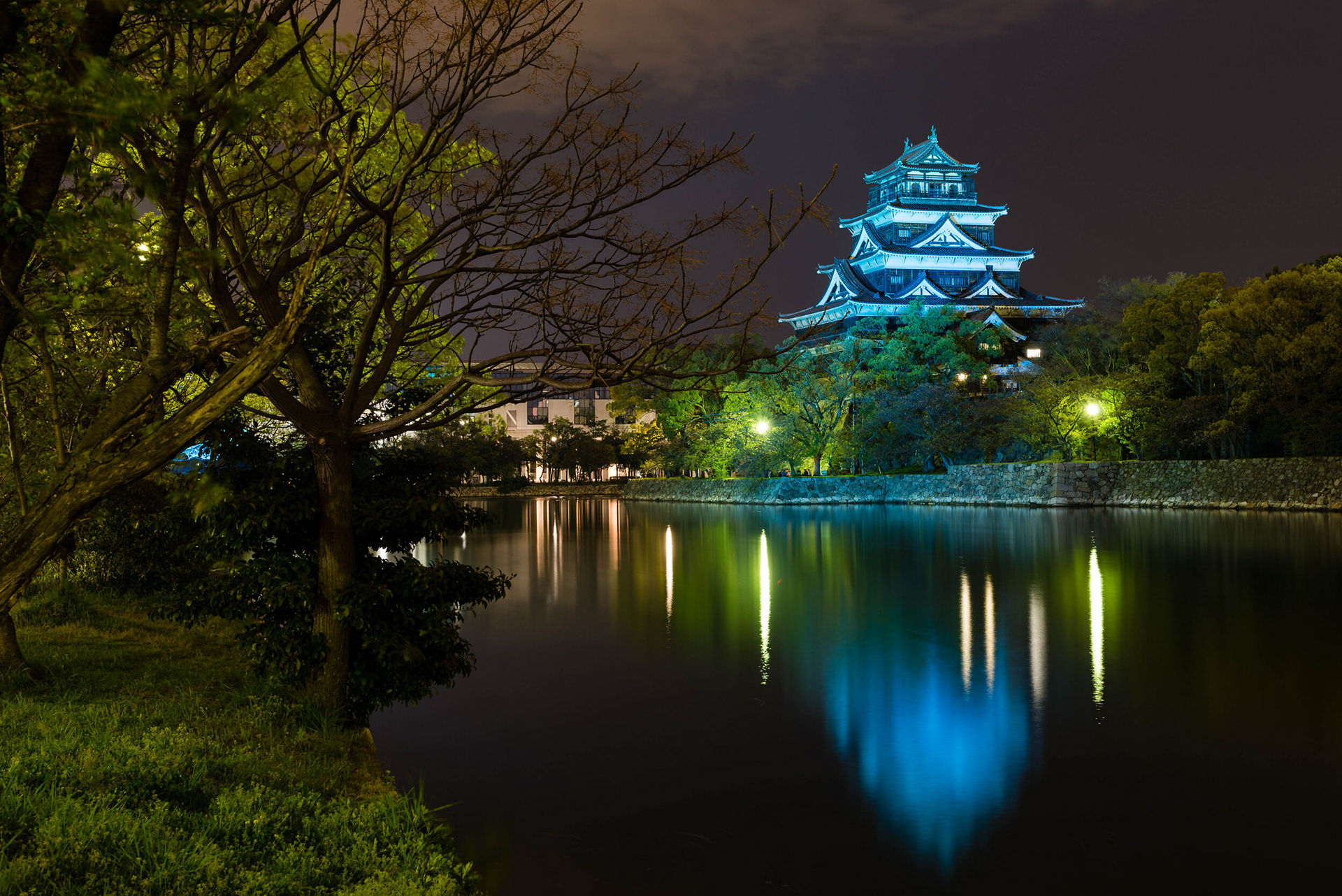 HIROSHIMA'S REFLECTIONS - Reflections of Hiroshima Castle on the artificial lake that surrounds it.   Hiroshima, Hiroshima Prefecture, Japan.