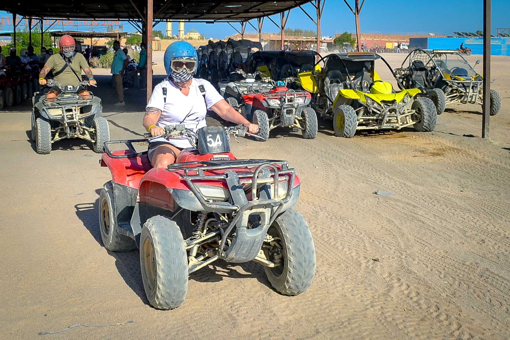 Lady and a man riding on quad biles