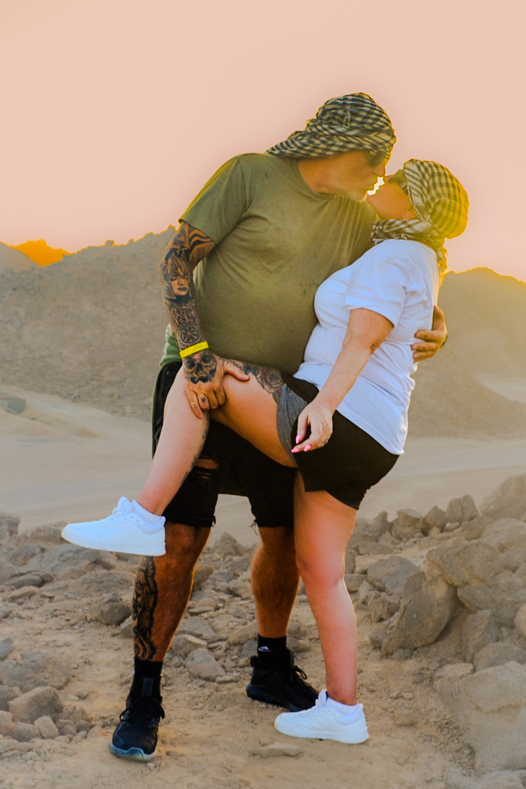 Couple kissing in the desert