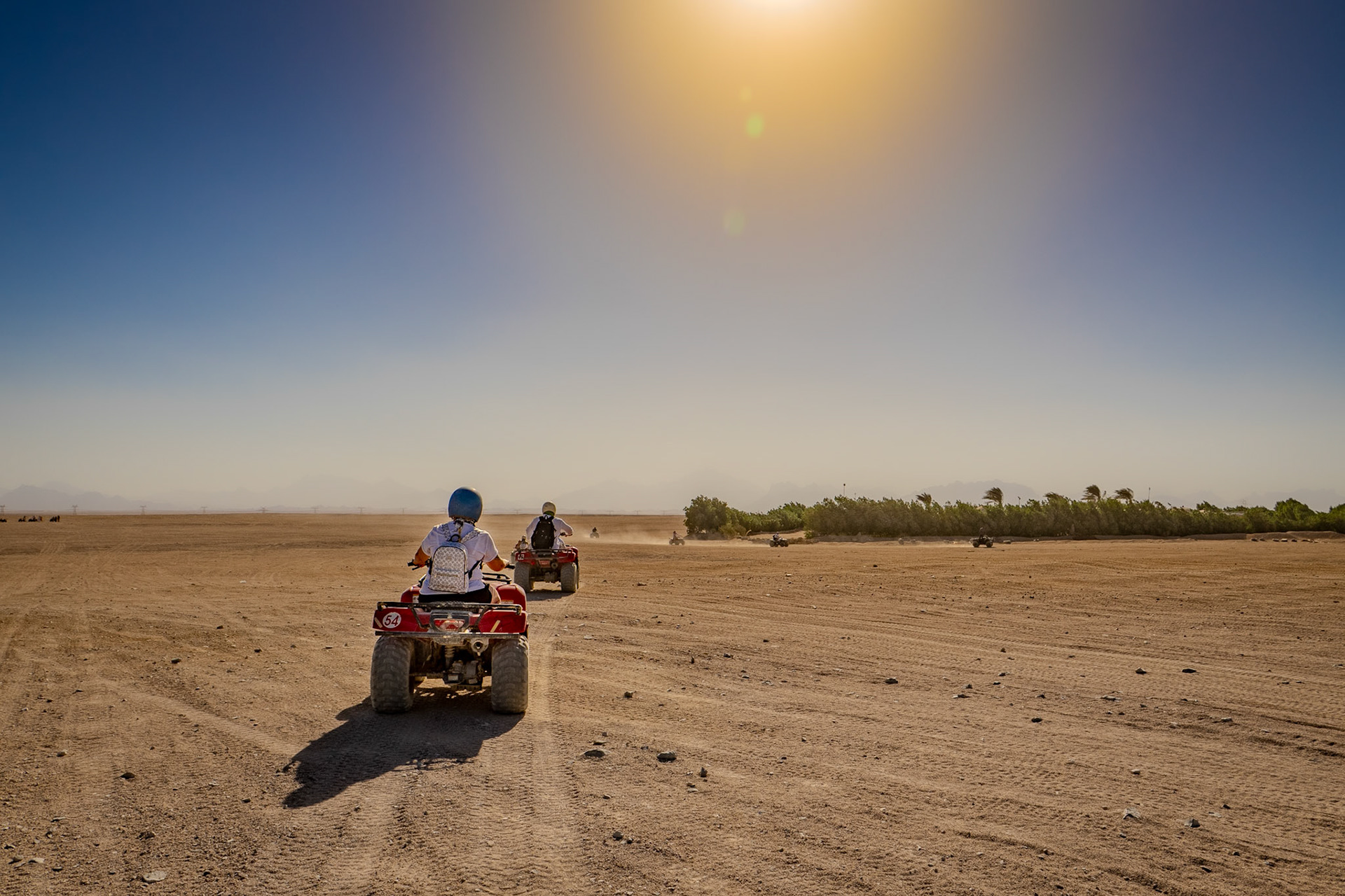 Lady and a man riding on quad biles