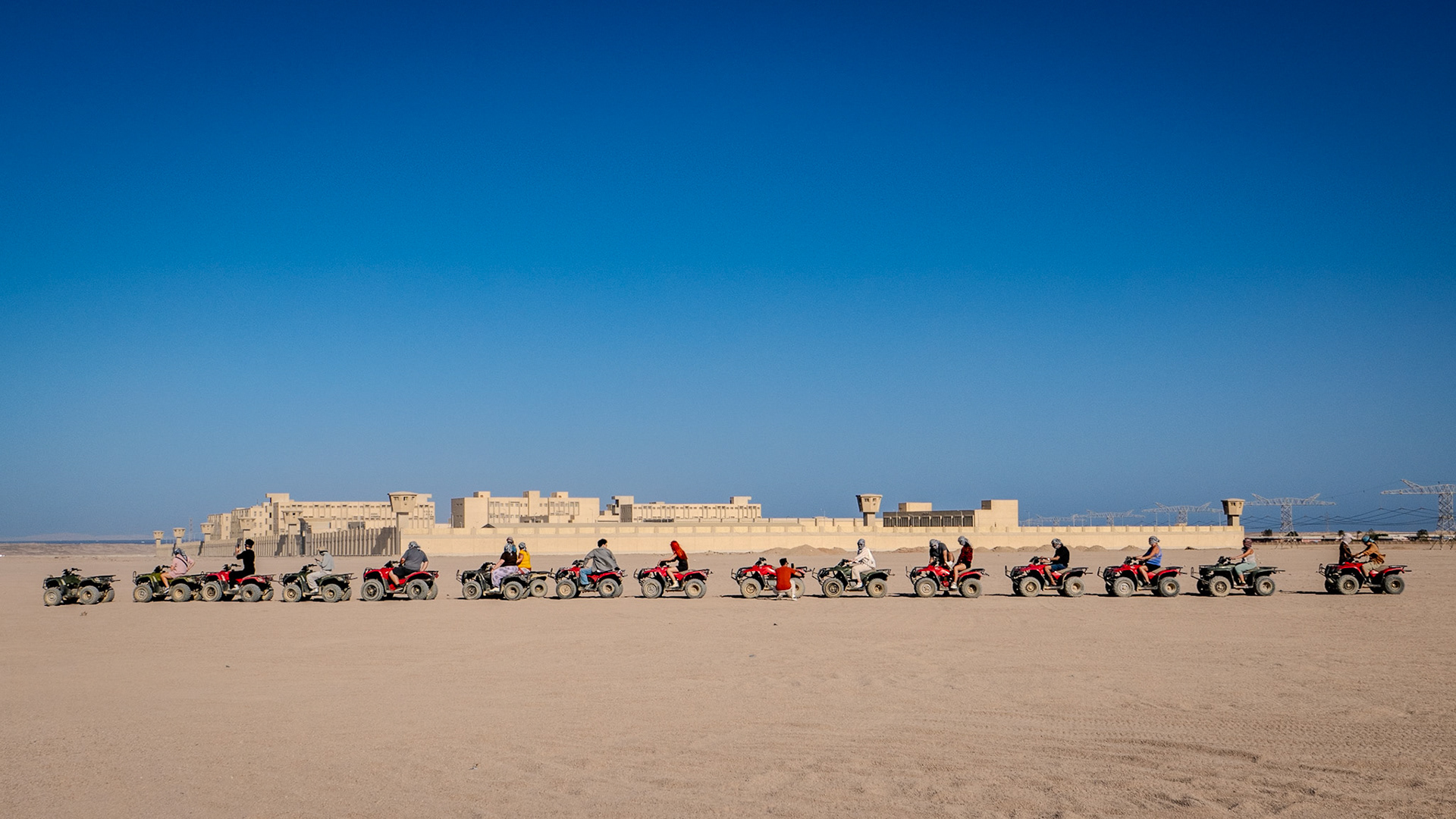 Many people riding on quad biles