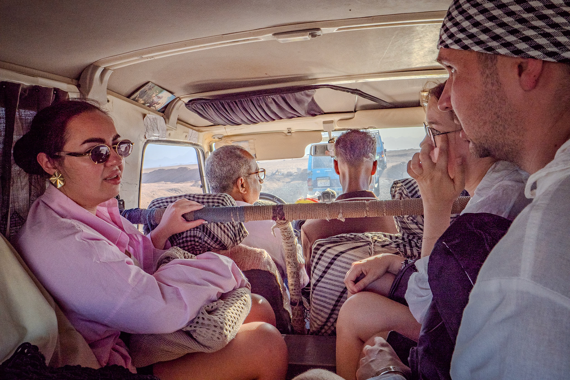 Passengers in the back of a Desert Safari Vehicle