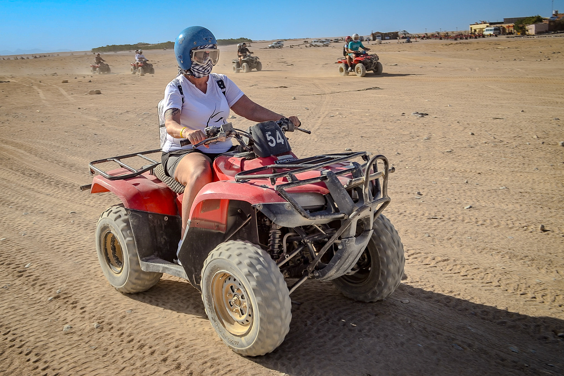 Lady riding on quad bile
