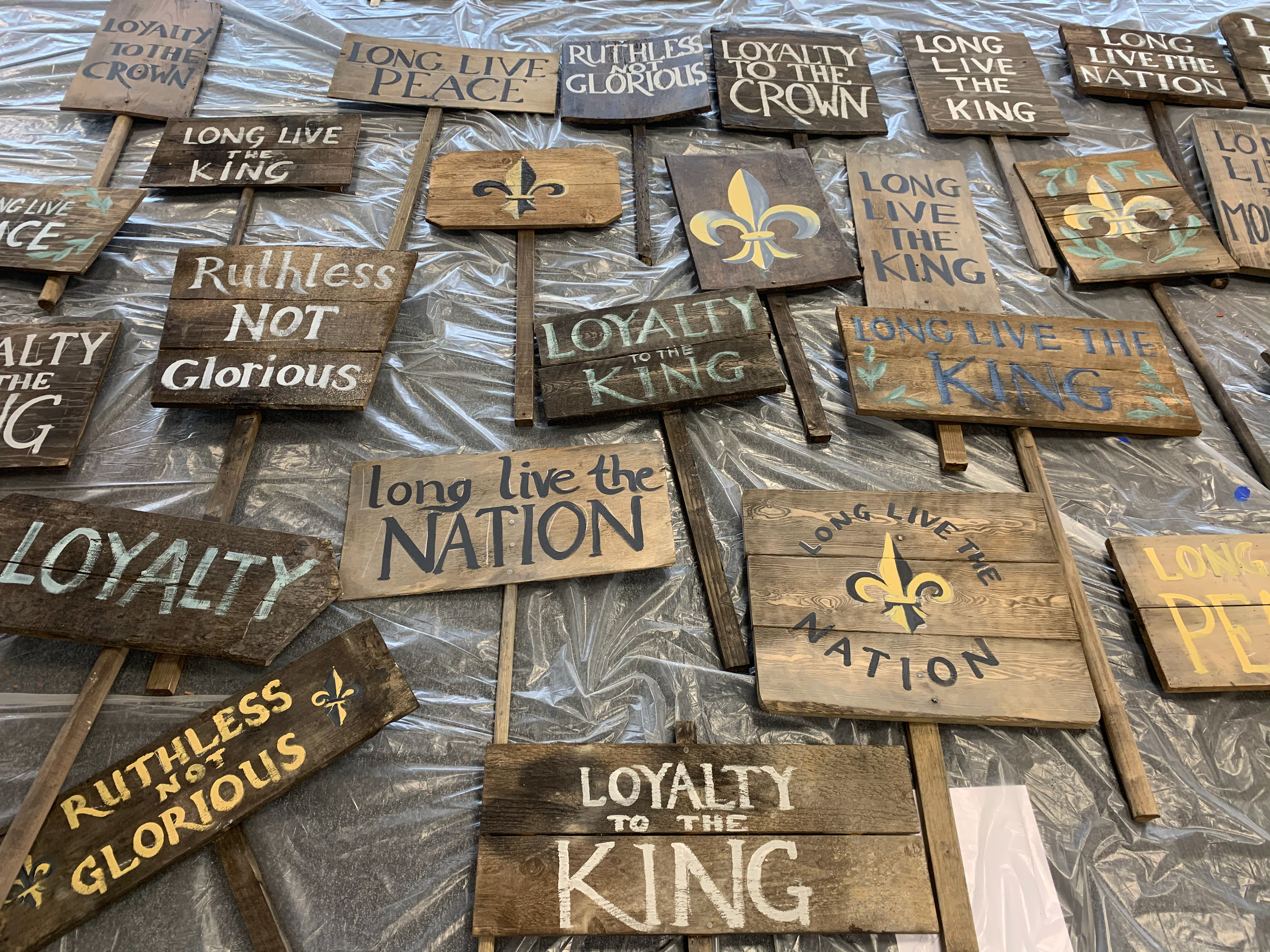 I helped the graphics team paint protest signage on wooden placards