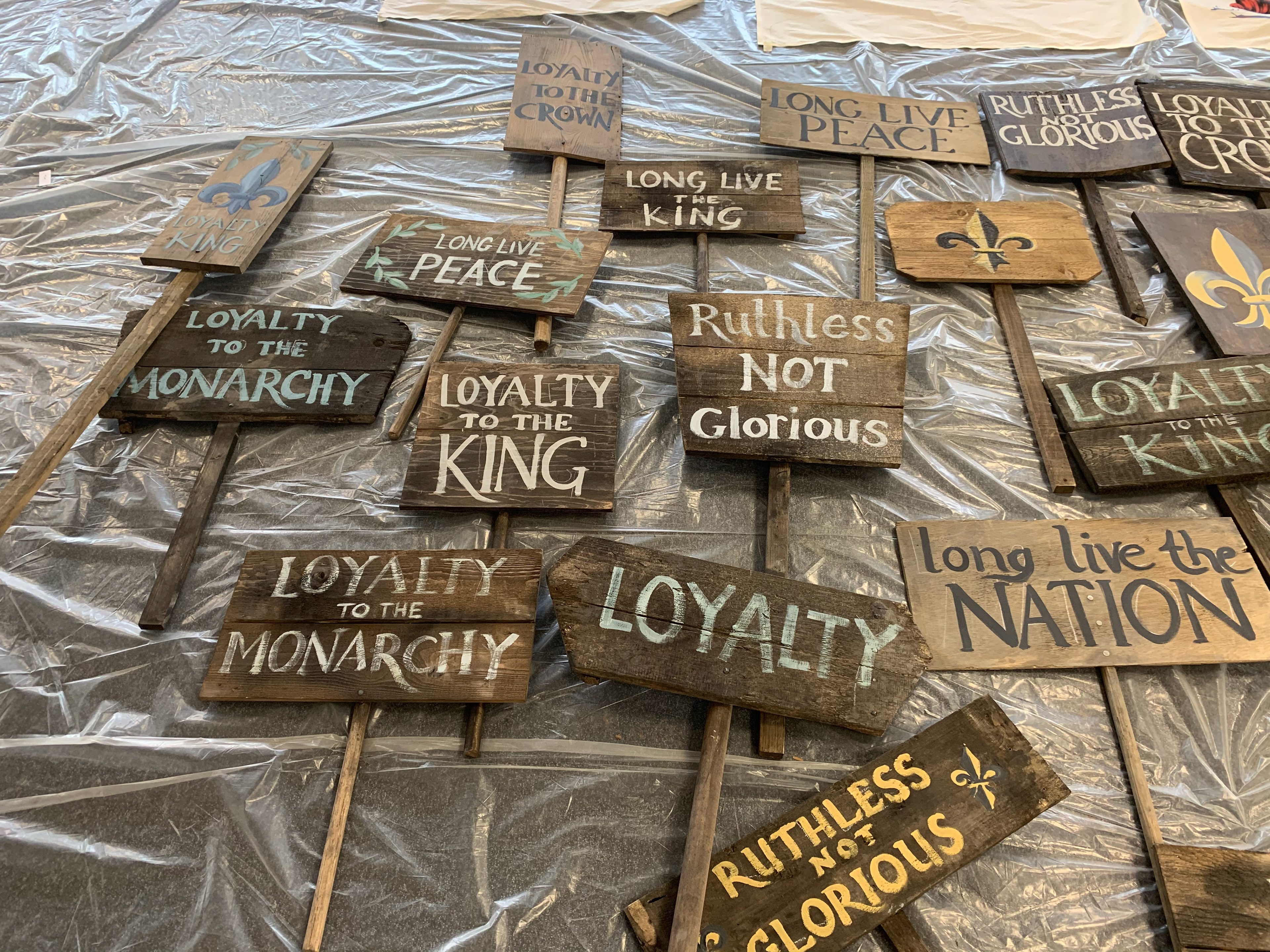 I helped the graphics team paint protest signage on wooden placards