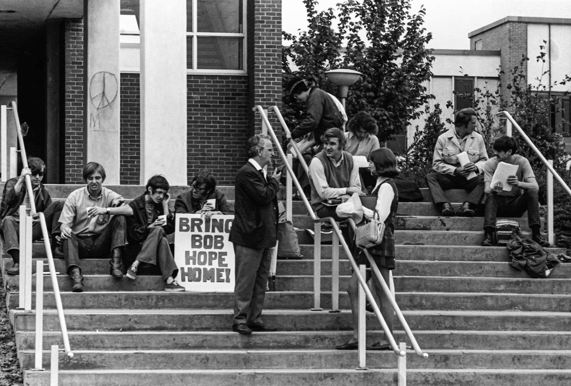 A professor stops to interact with the protesters