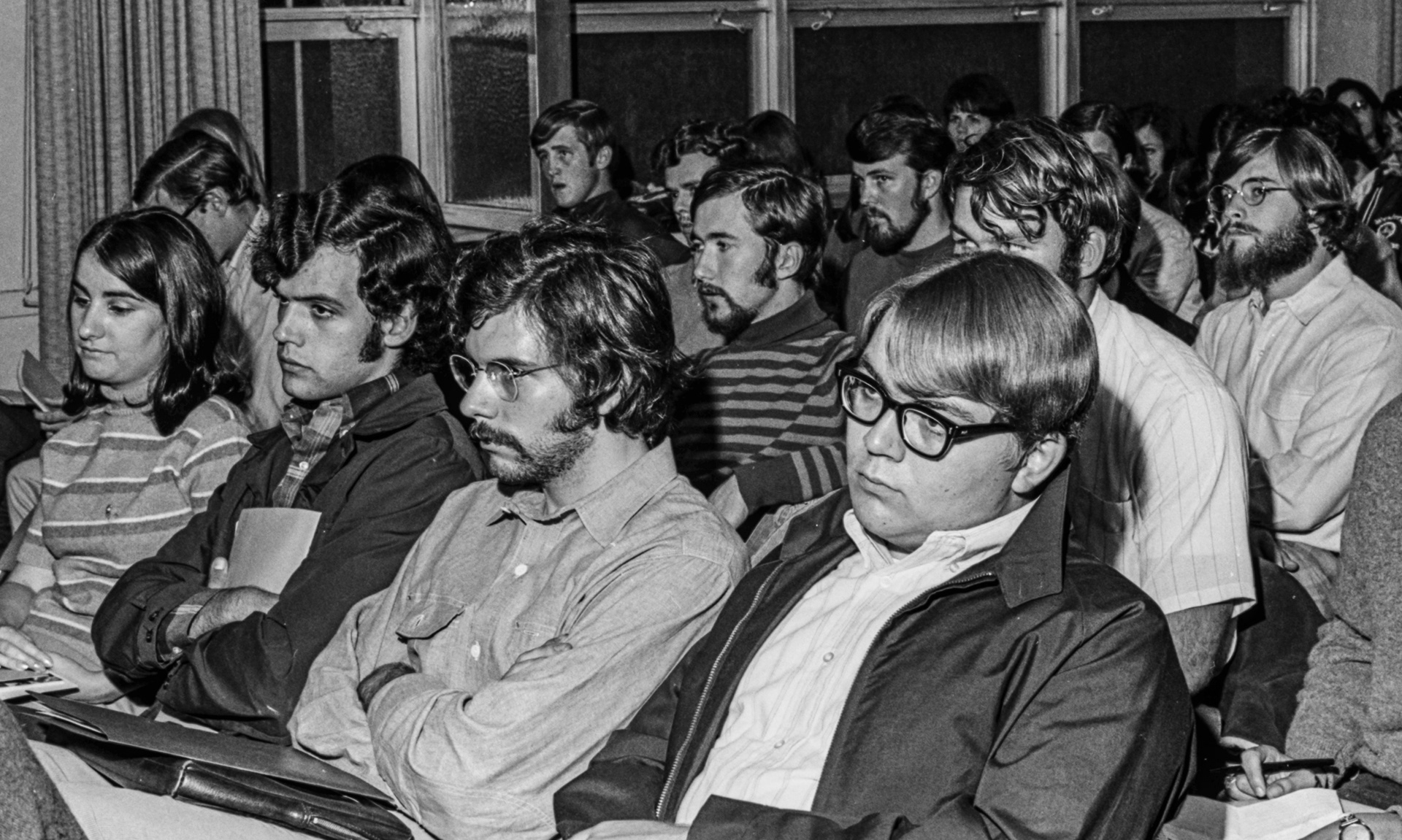 Crowd for an anti-war speaker in a campus classroom