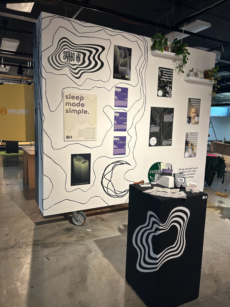 Showcase Set Up, Wall is decorated with nails and yarn to create pattern