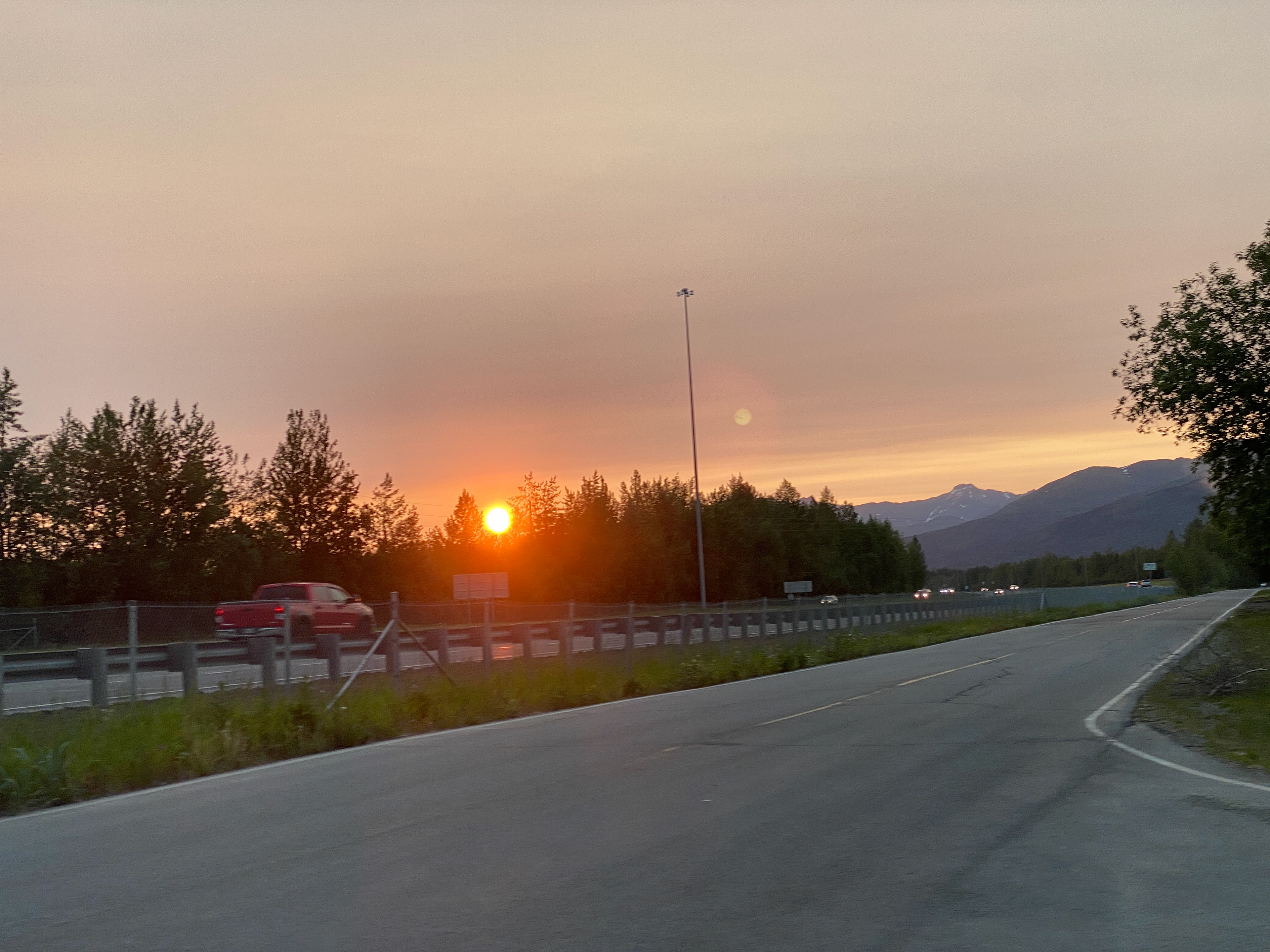 The fire of a low-set summer Alaskan sun
