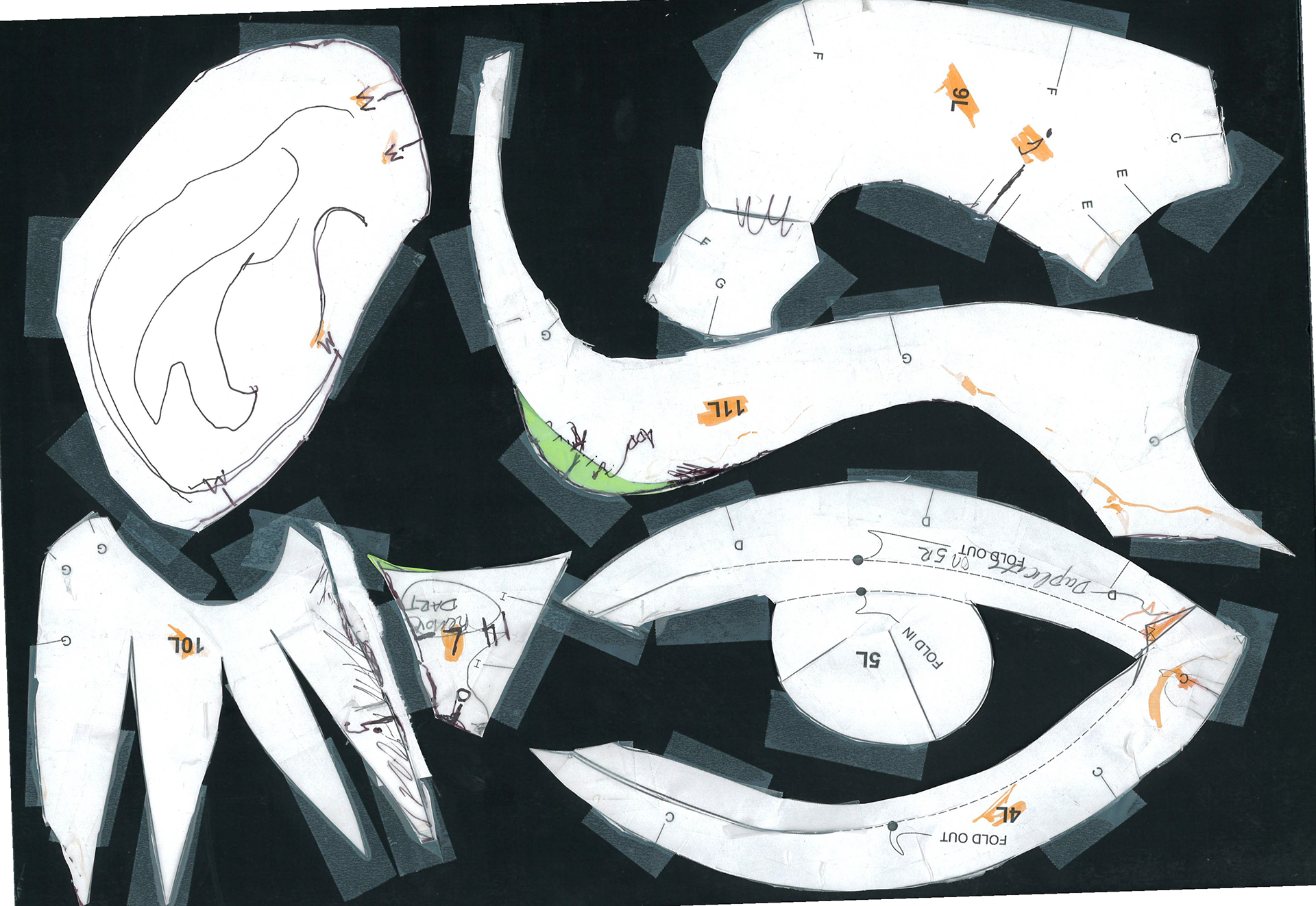 Green paper indicates areas where pattern needed to expand to close seams in 2 inch scale pattern. 