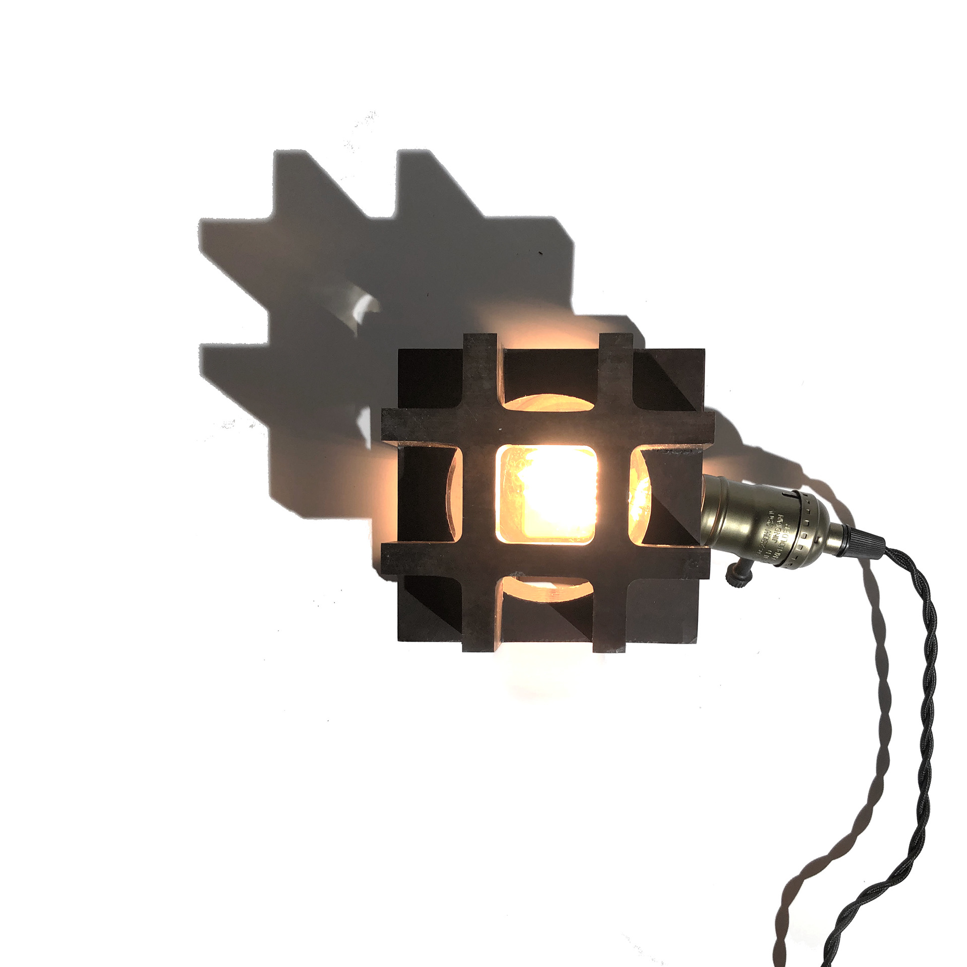 Temporal Desk Lamp fabricated through a CNC Mill of an encapsulated light bulb to illustrate the temporal nature of the unchangeable light bulb within.